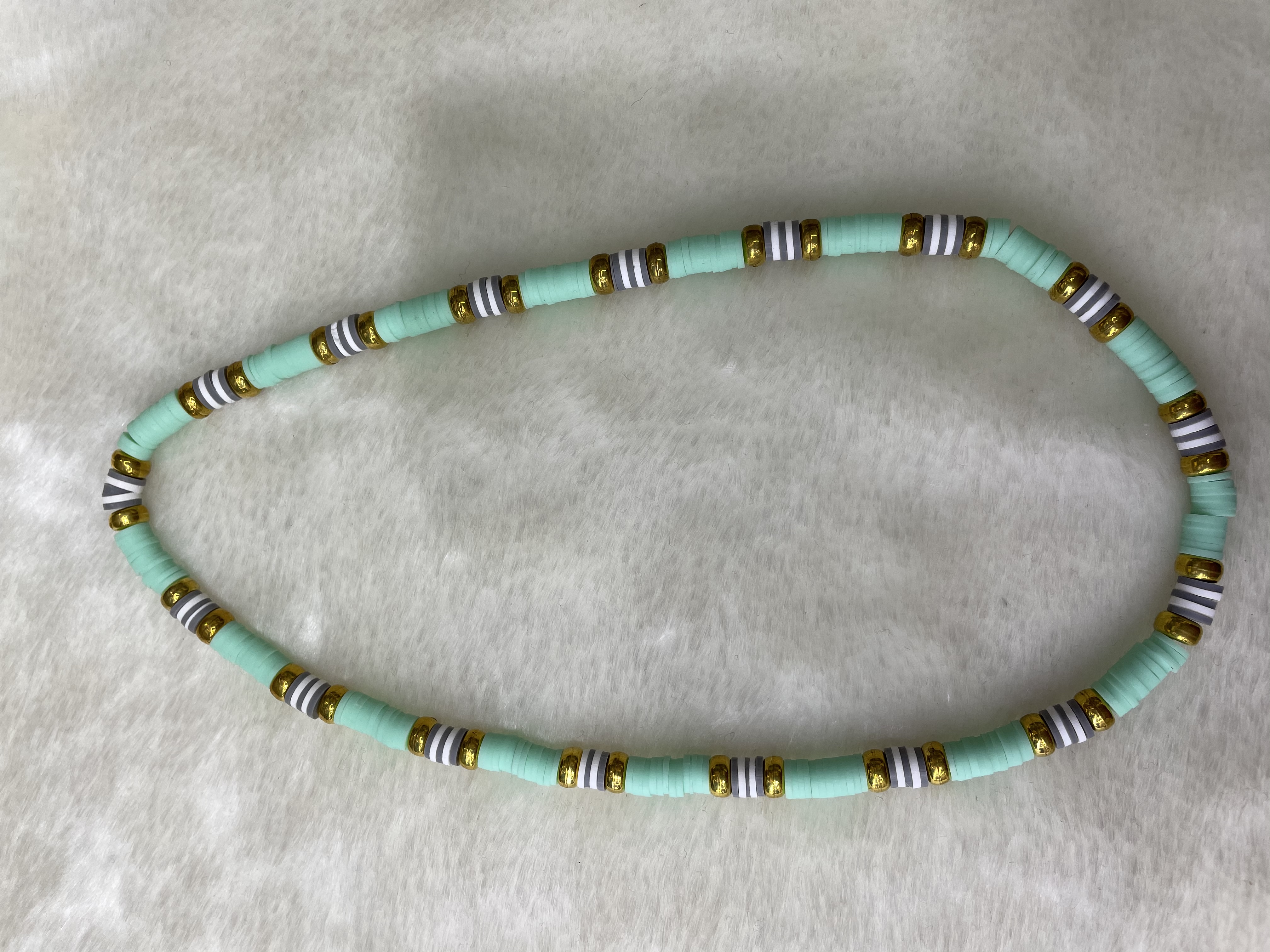 Soft ceramic shard and gilded flat bead necklace. Soft ceramic shard and gilded flat bead necklace details Picture