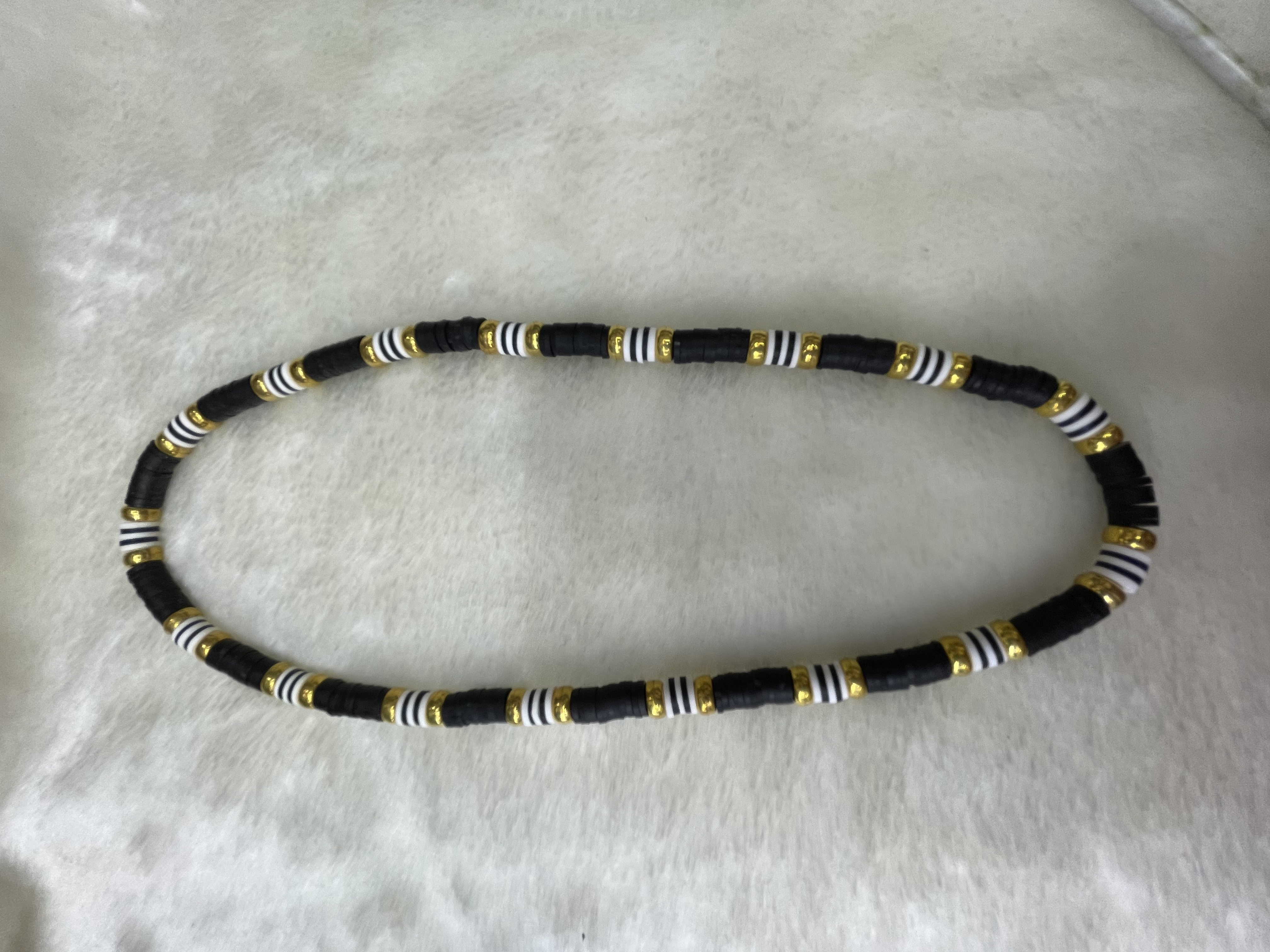 Black soft ceramic shard and gold-plated flat bead necklace details Picture