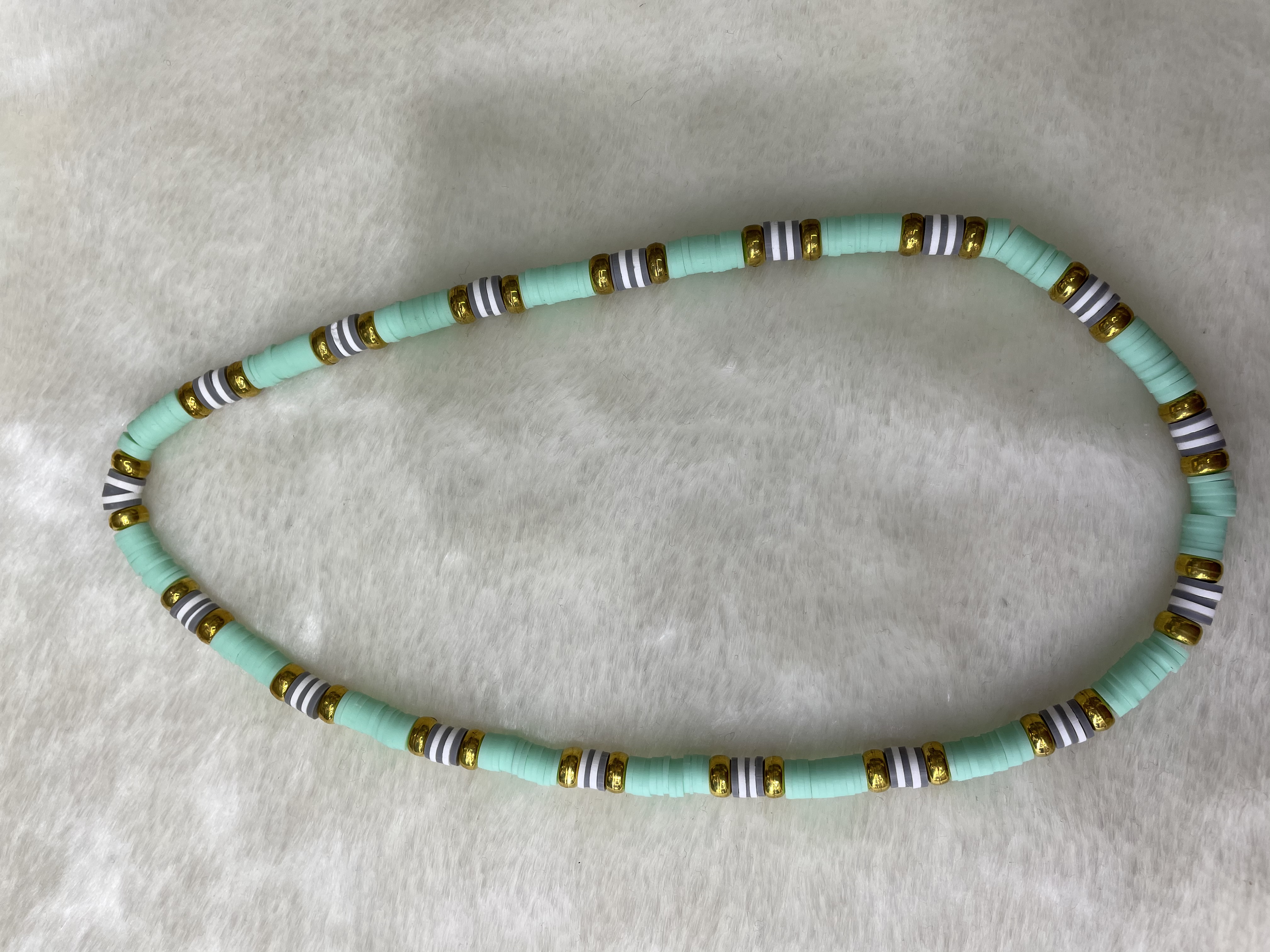 Soft ceramic shard and gilded flat bead necklace. Soft ceramic shard and gilded flat bead necklace
