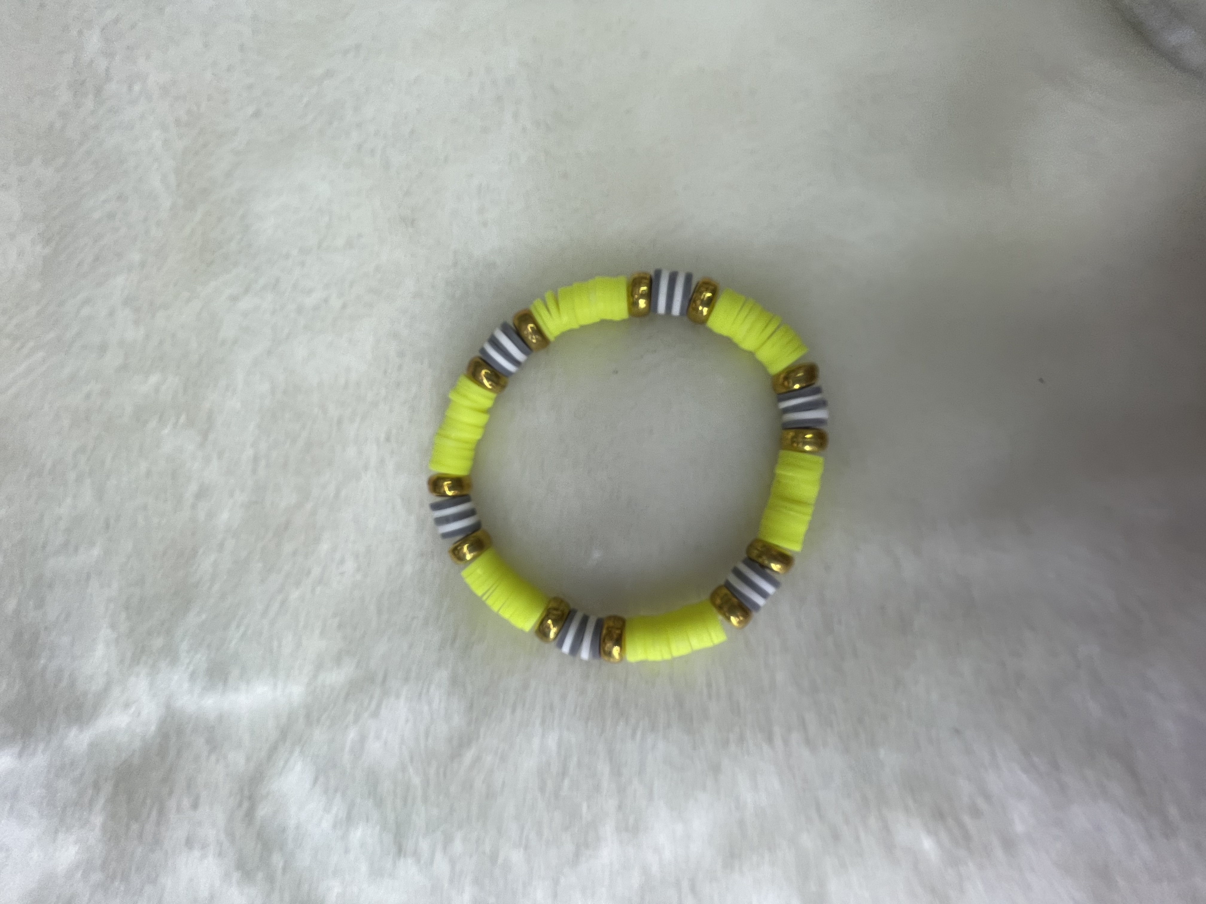 Yellow soft ceramic pieces with gold-plated flat bead handrings details Picture