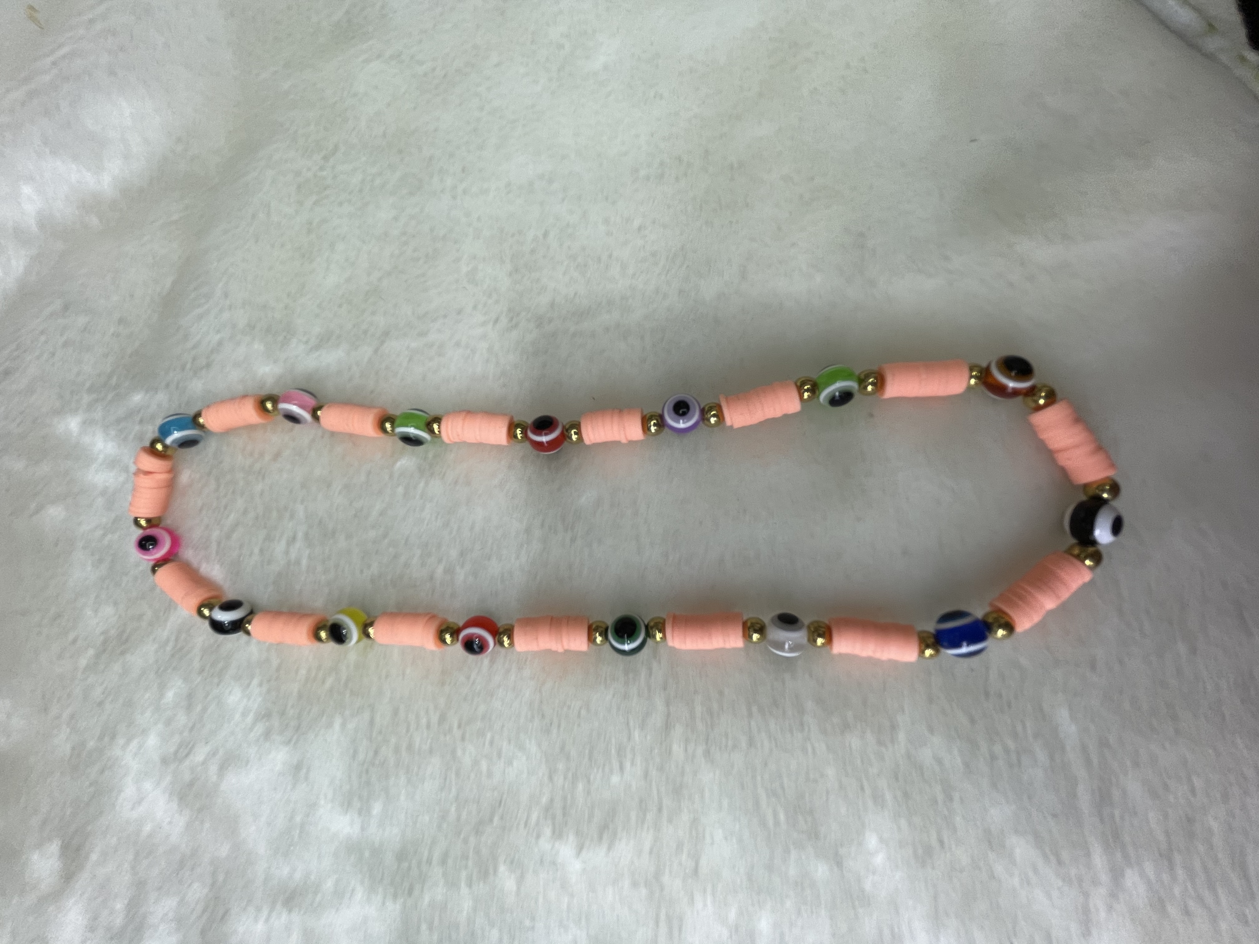 Light apricot-colored soft terracotta shards with eye necklace Application Scenario