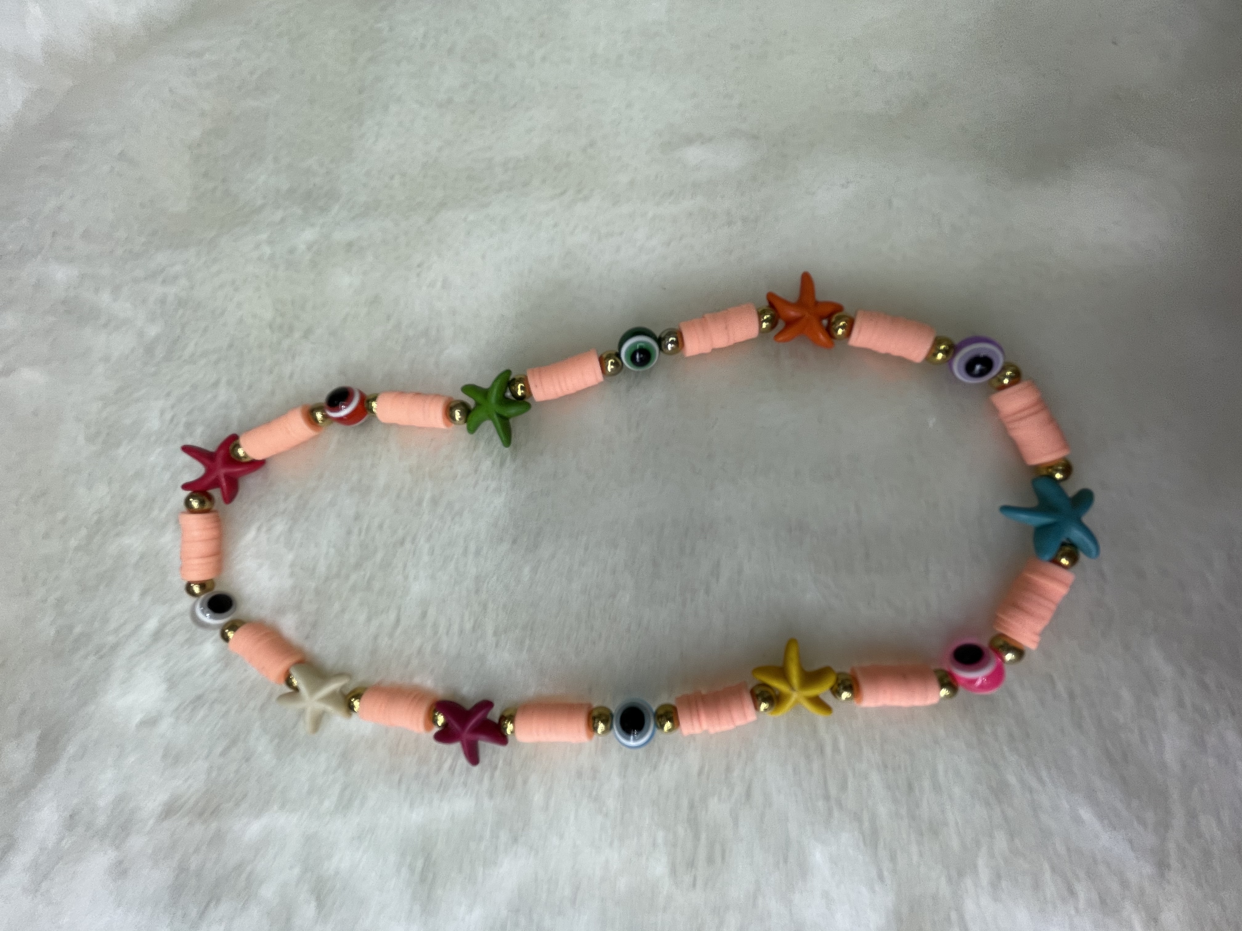 Orange soft ceramic shards with starfish necklace Orange soft ceramic shards with starfish necklace Specification image