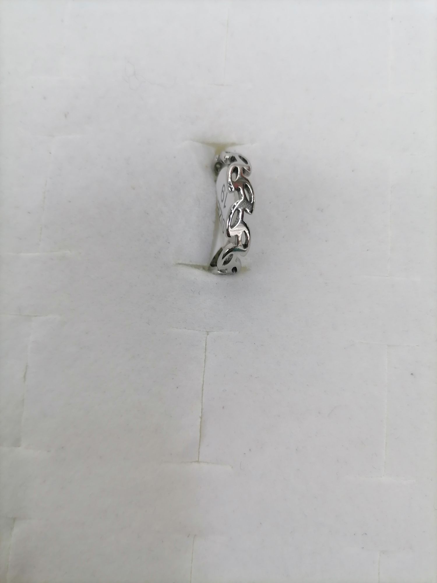 Titanium steel silver perforated leaf-shaped layout design