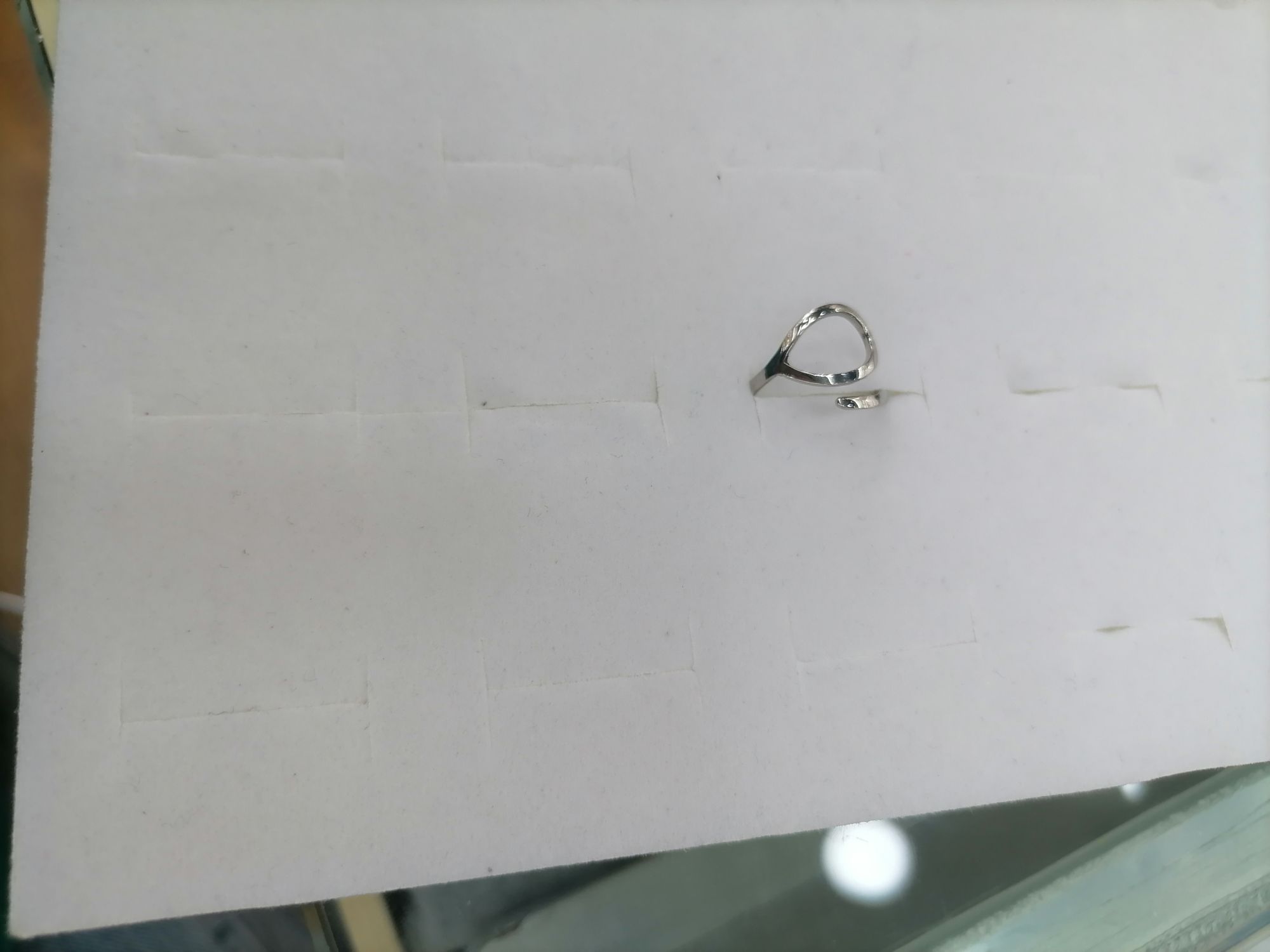 A titanium steel silver ring with a hollowed-out oval on top and a line at the bottom detail image 2