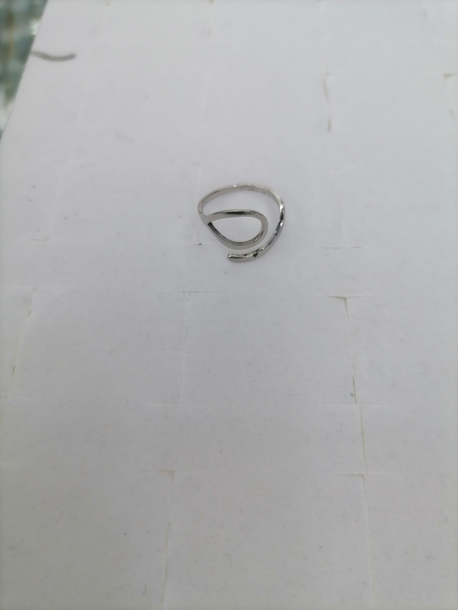 A titanium steel silver ring with a hollowed-out oval on top and a line at the bottom detail image 3