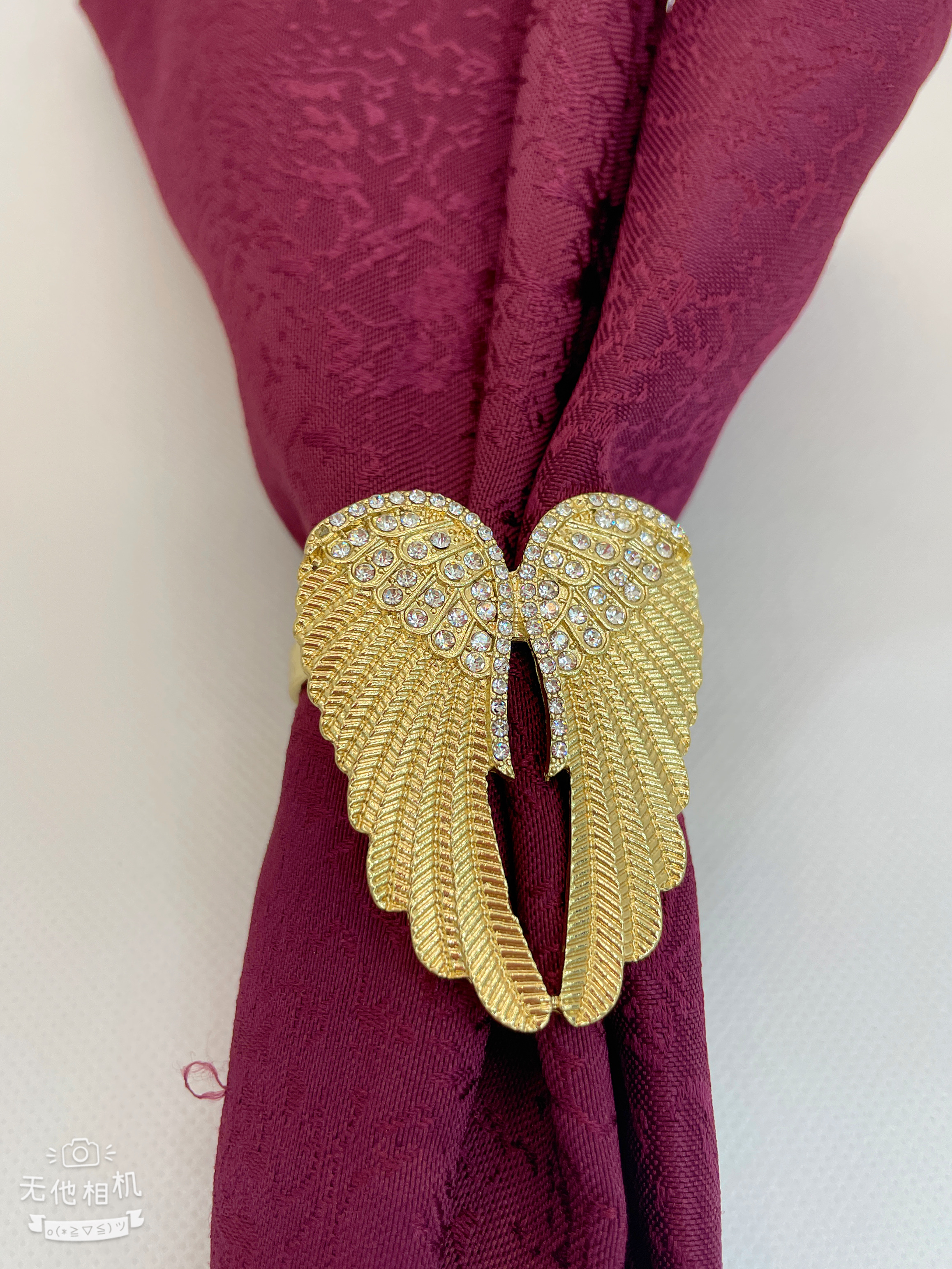 Napkin rings, wing designs, and accessories for hotel table decorations.