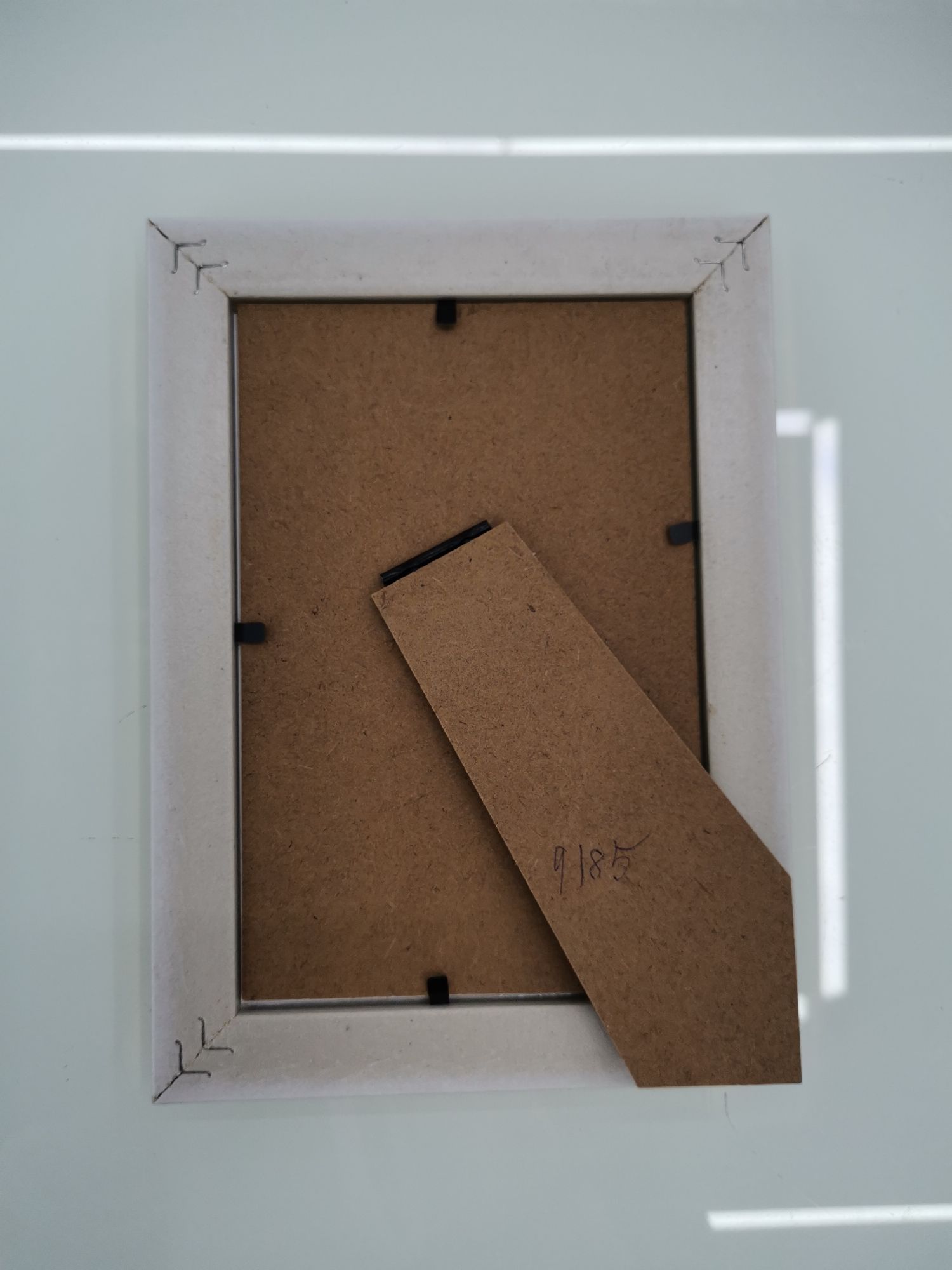 Simple photo frame display table, indoor decoration resin photo frame manufacturer wholesale stock photo frame display table Specification image