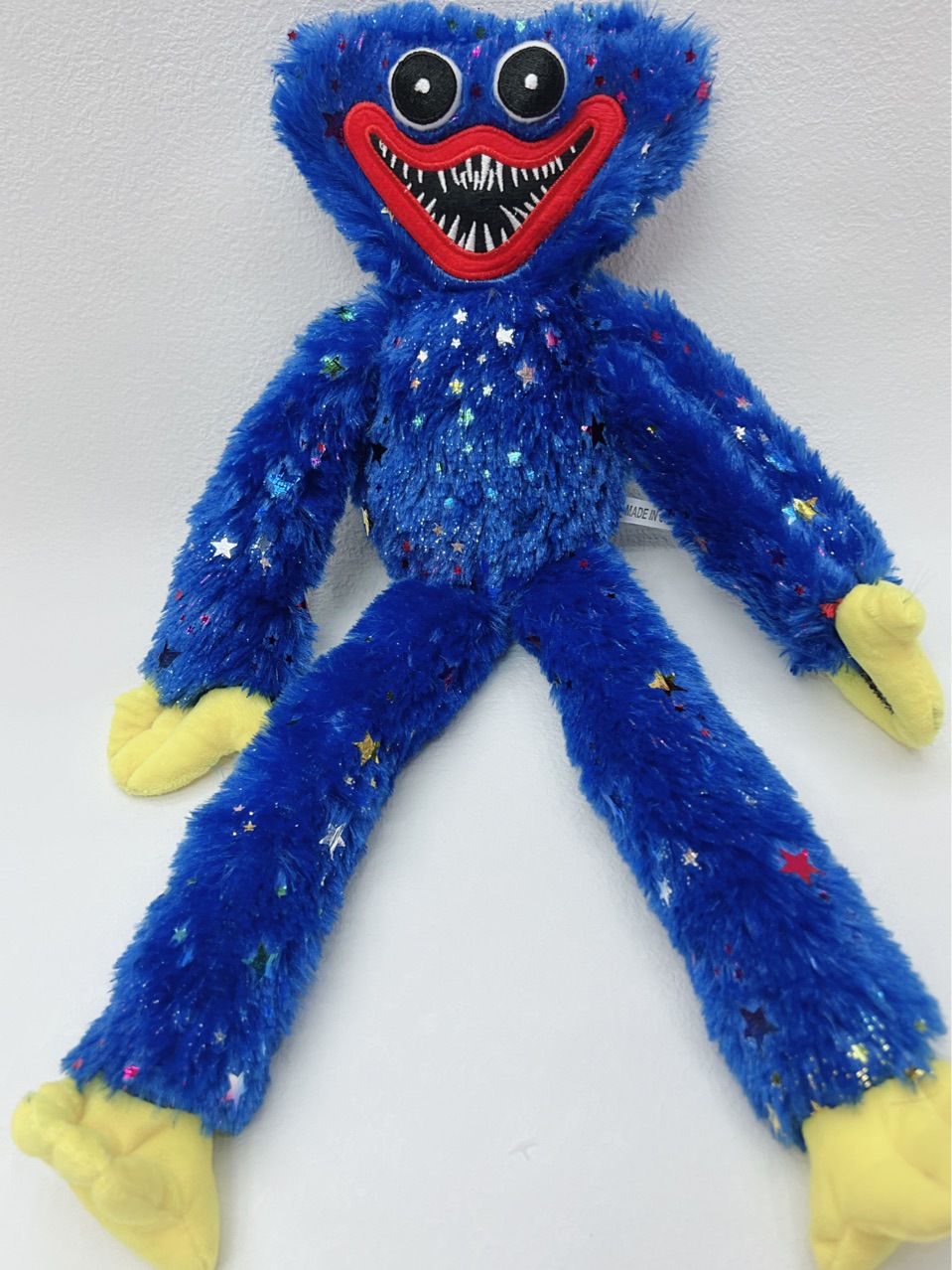 Plush embossed star Bobby figurine, plush shiny Bobby toy figurine, Bobby embossed star Bobby plush details Picture