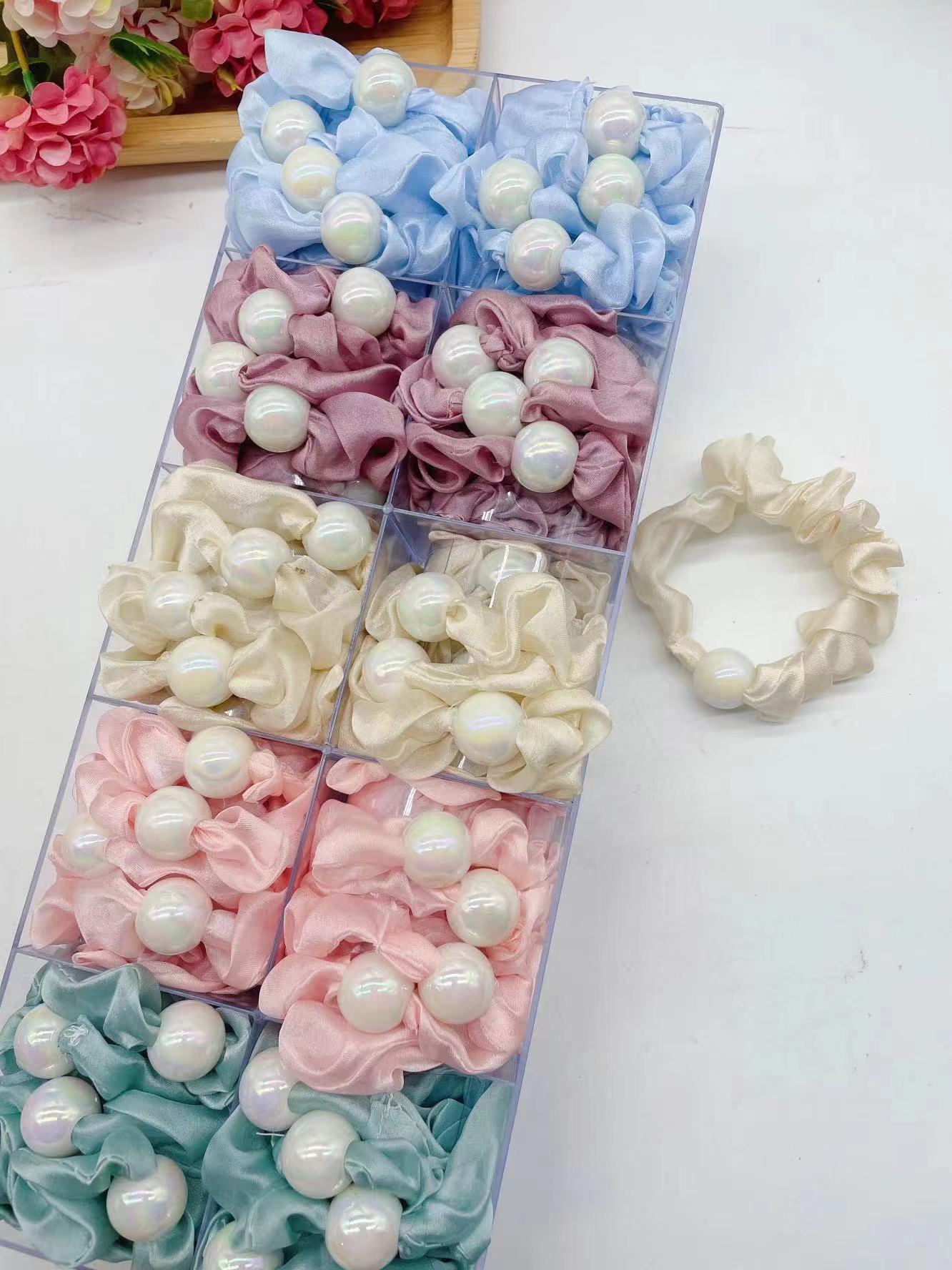 Pearl rings are selling well across borders. 60-color solid color, bright color, Ding pig large intestine rings, hair rings, elastic hair rings are directly supplied by the manufacturer
