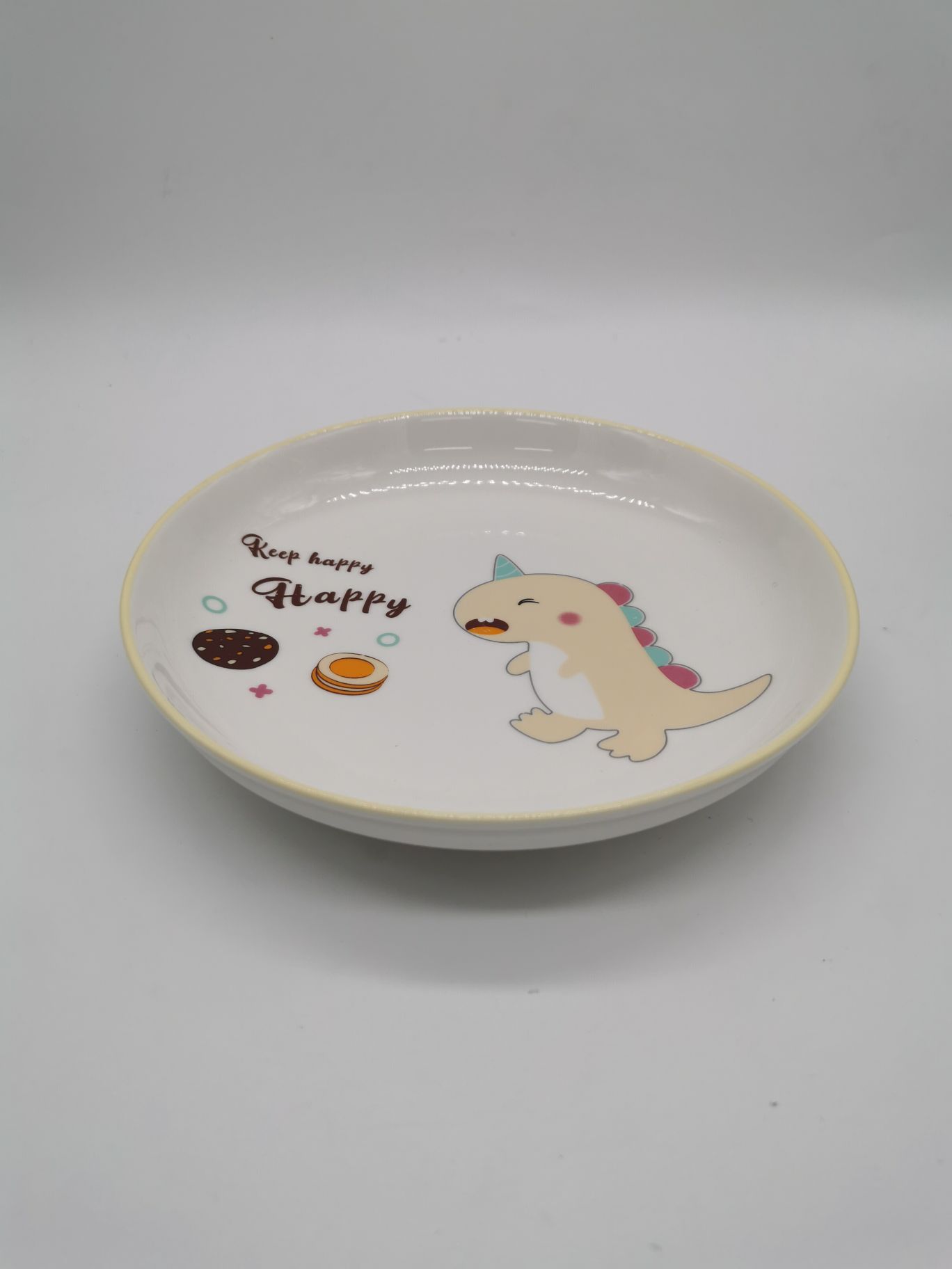 黄色卡通恐龙陶瓷圆盘