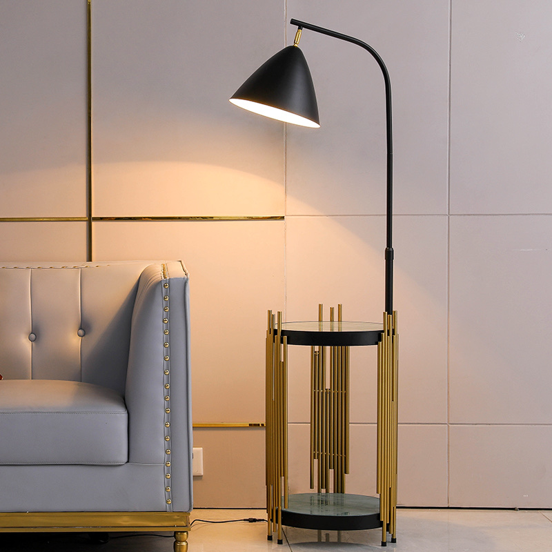 A golden and black table with a ground lamp Item Picture