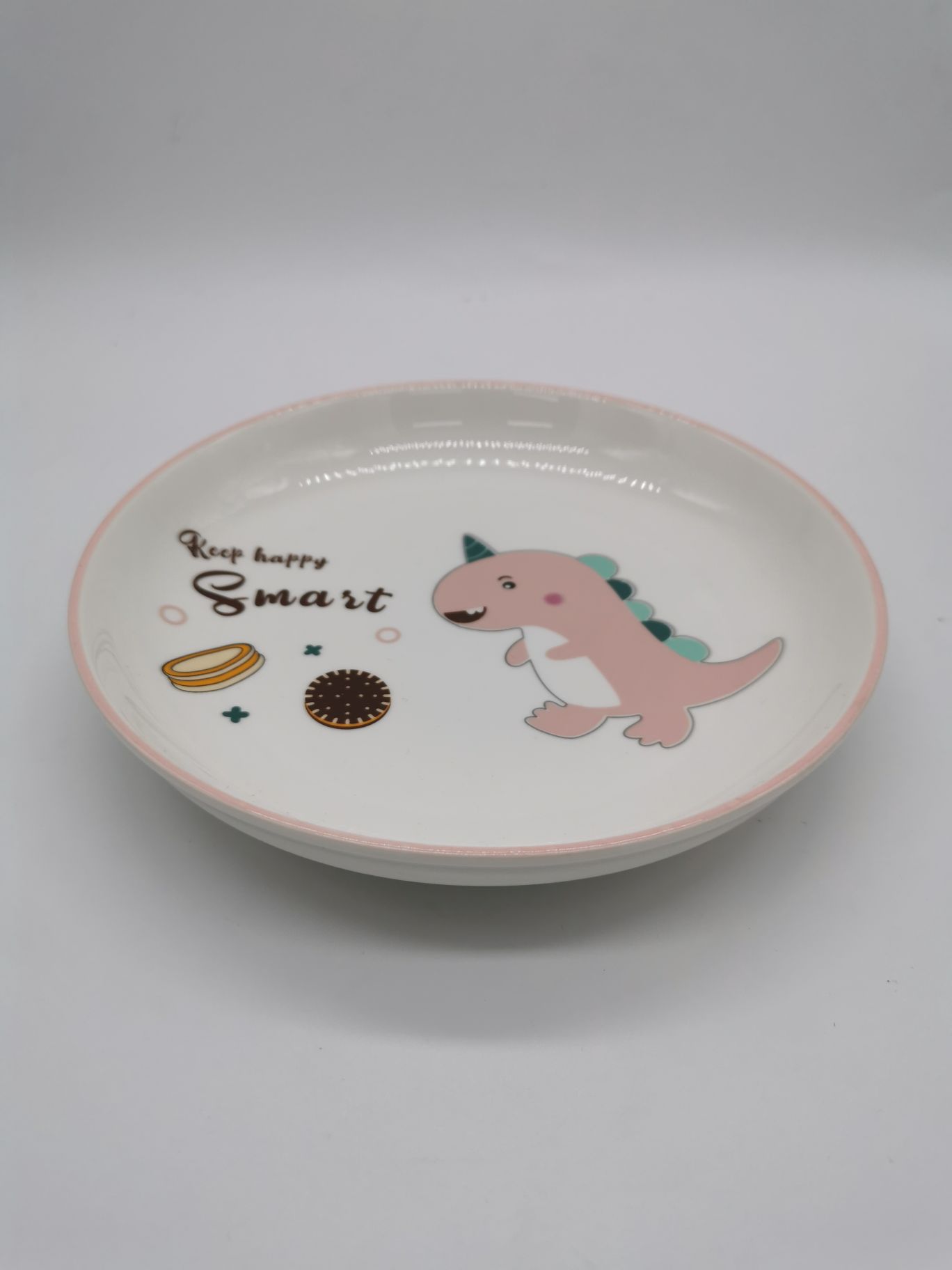 粉色卡通恐龙陶瓷圆盘