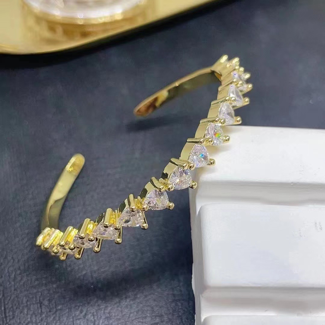 New popular accessories from Europe and America: Women's copper micro-inlaid zircon hollowed-out design bracelet, colorful zircon heart bracelet details Picture