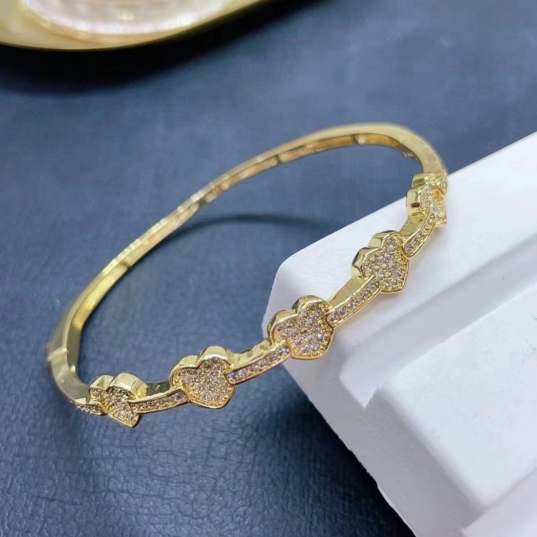 New popular accessories from Europe and America: Women's copper micro-inlaid zircon hollowed-out design bracelet, colorful zircon heart bracelet detail image 5