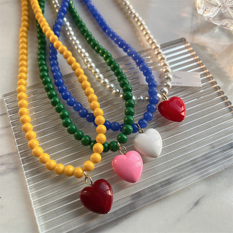 A fashionable, colorful beaded heart-shaped collarbone chain and candy-colored necklace of the same style from cross-border Korea