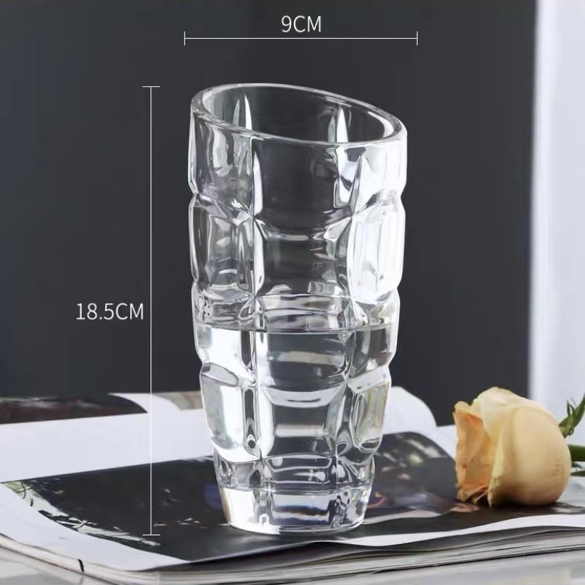 Crystal glass vase with a slanted mouth and a large belly