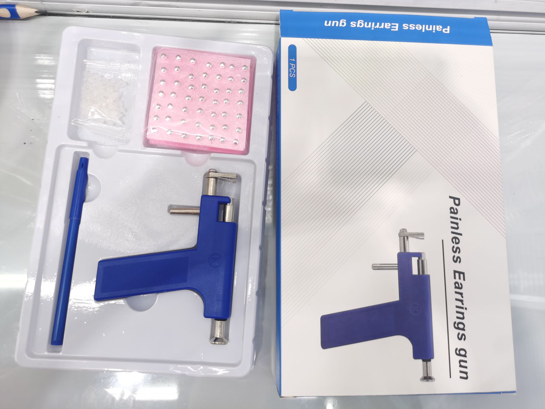 Painless ear piercing device set