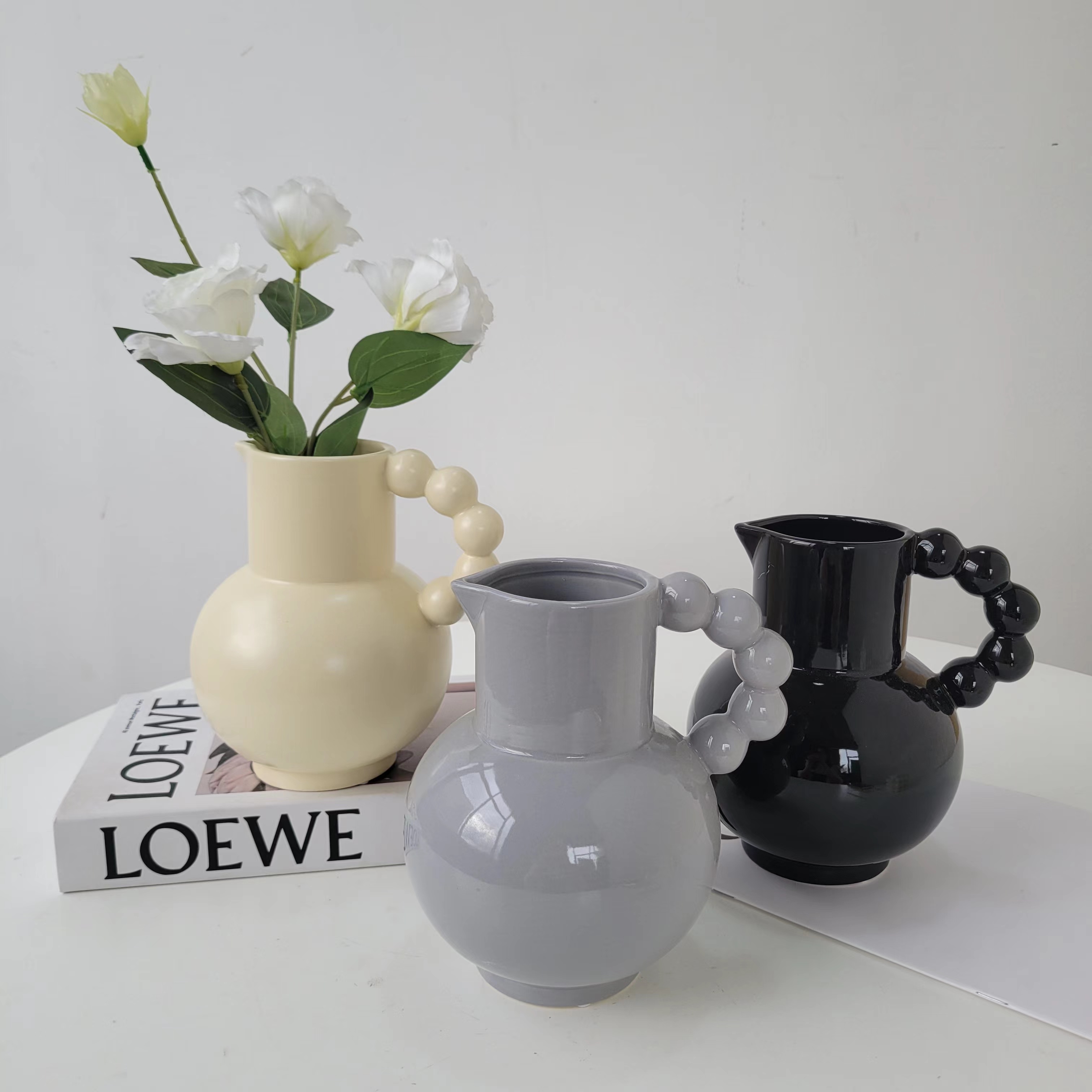 Circular handle teapot vase