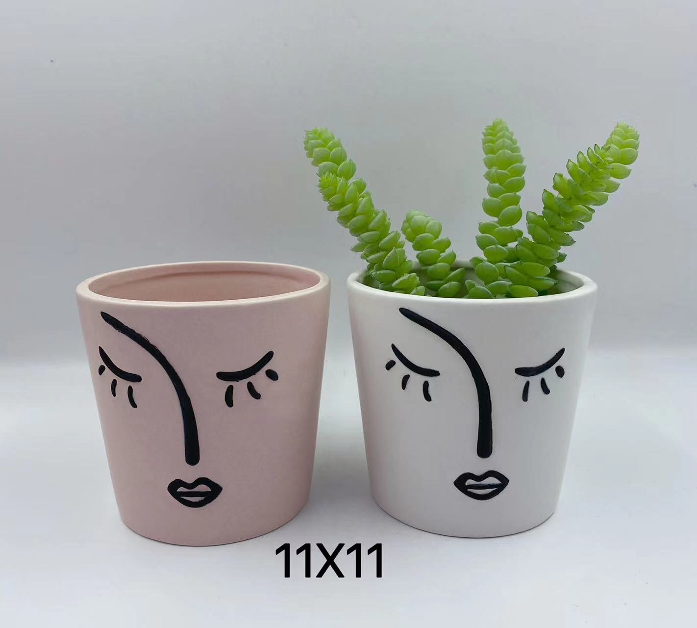 Ceramic flowerpot with human face details Picture