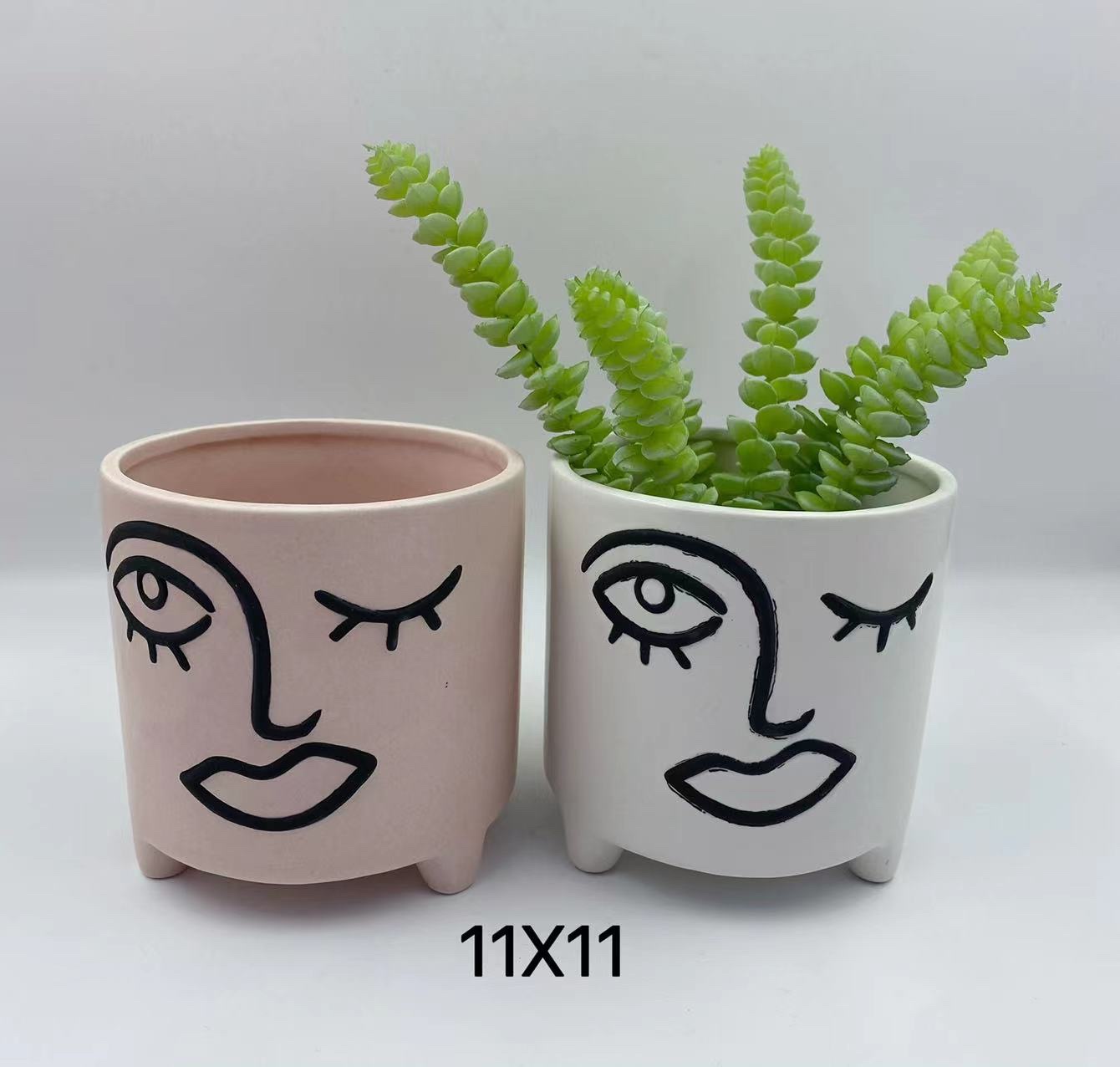 Ceramic flowerpot with human face