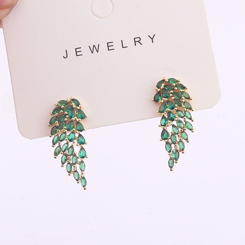 European and American cross-border creative copper gold-plated colored zircon inlaid symmetrical angel wing-shaped ear studs detail image 4