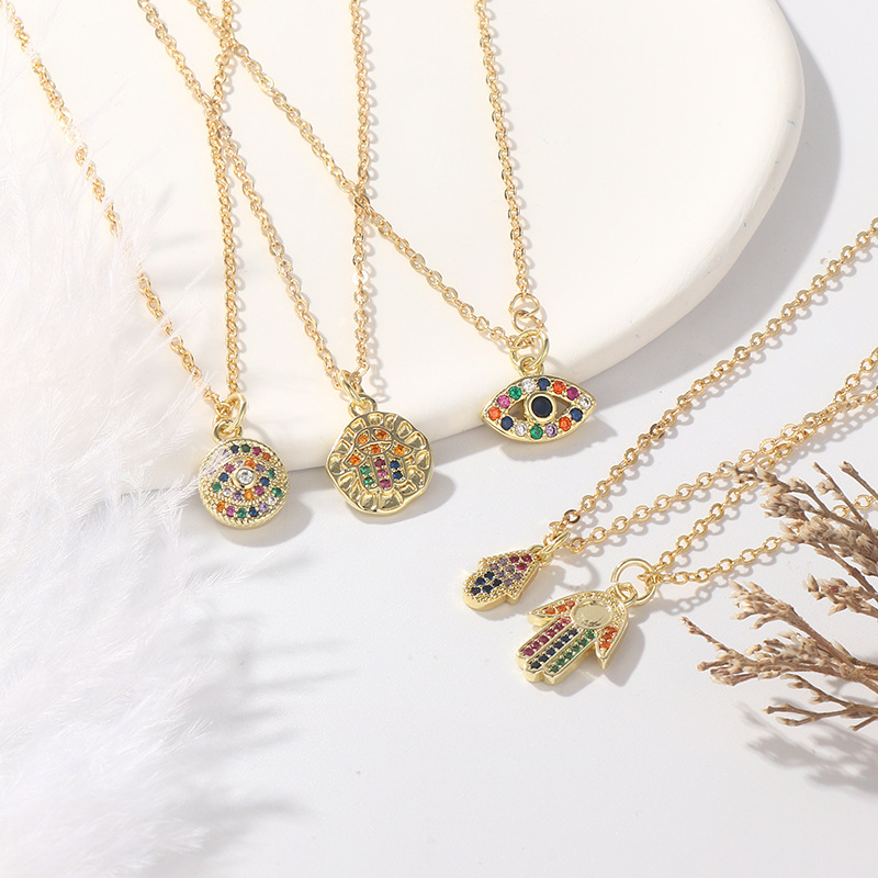 Fashionable copper-plated with real gold and slightly inlaid zircon geometric palm eye-shaped pendant