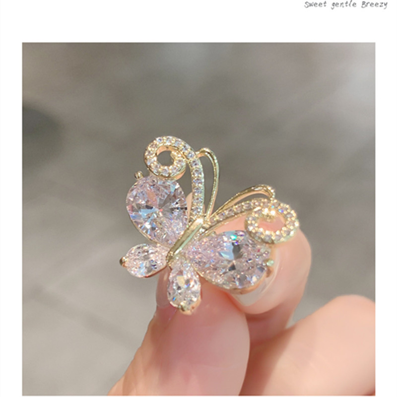 The "Butterfly Emerging from Cocoon" crystal brooch, a niche design with anti-glare clasp and butterfly collar needle, is a fixed accessory for women's coats Application Scenario