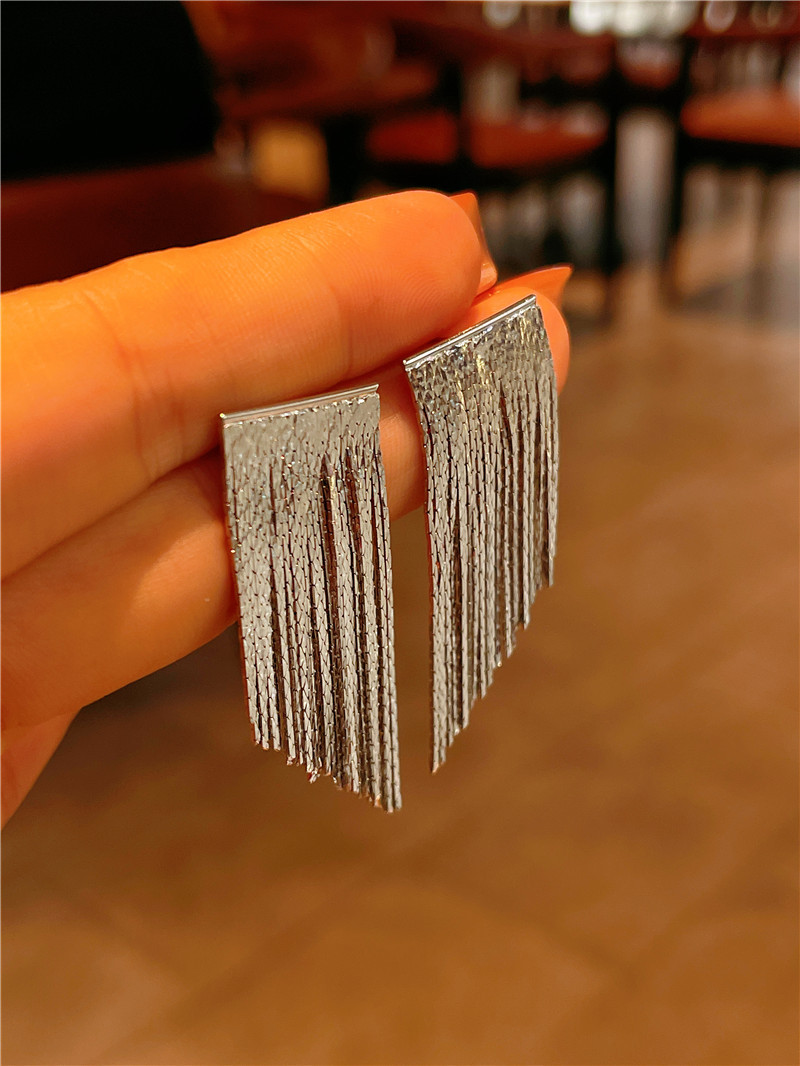 Fashionable and high-end geometric light plate flowing year arc-shaped tassel earrings, simple design sense earrings detail image 4