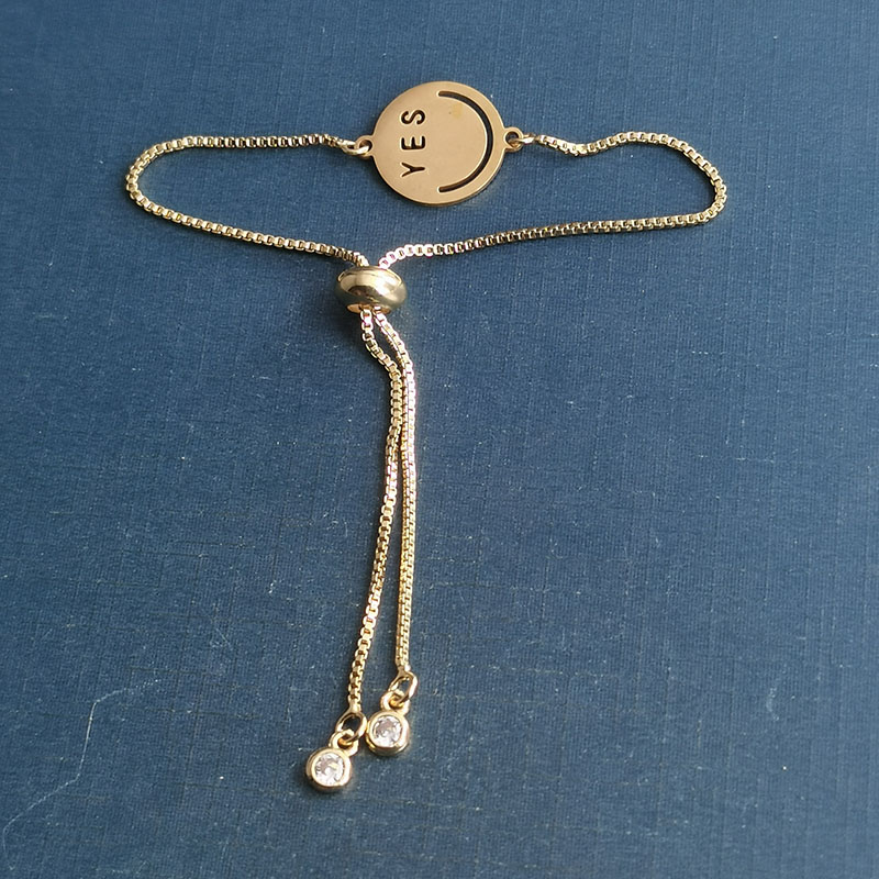 This is a popular and trendy titanium steel smiley yes bracelet pendant with a hip-hop punk expression for couples Application Scenario