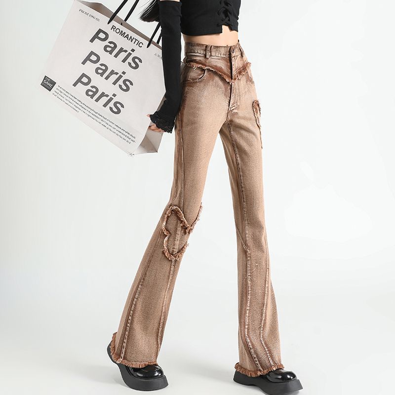 The new autumn vintage fringed and ripped denim flared jeans are slimming and slimming, with a unique and stylish patchwork stretch women's long jeans details Picture