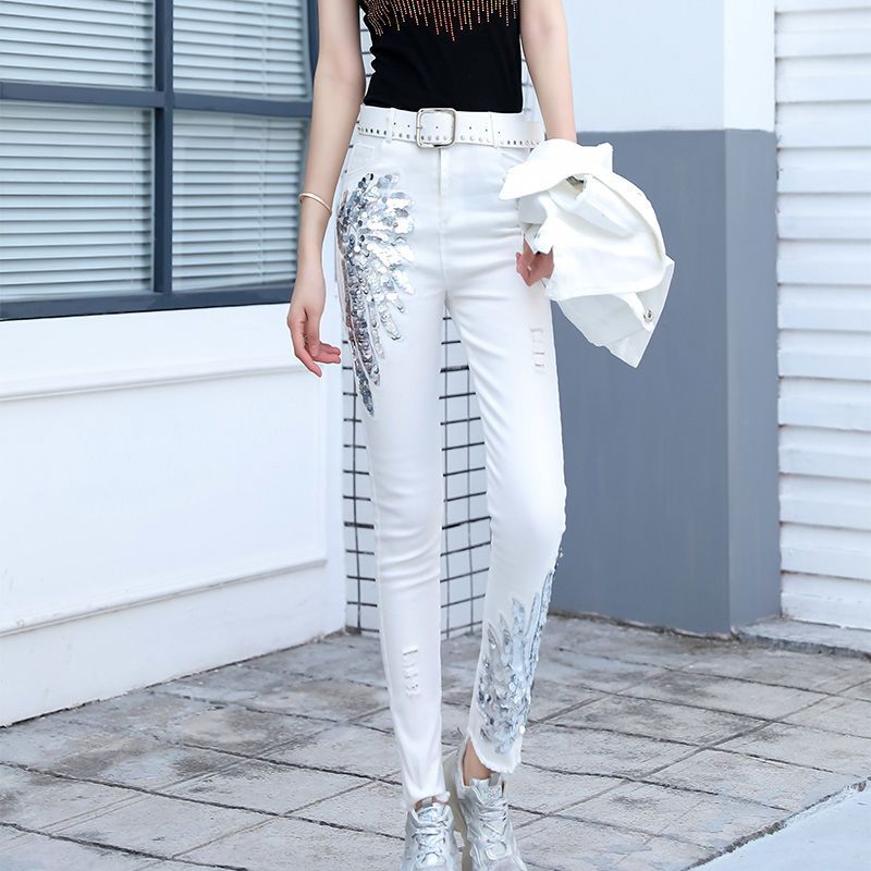 The 2023 new Korean style denim long pants for women are slimming and slimming with sequined phoenix flowers. They are trendy with small feet and fringed pencil pants detail image 2