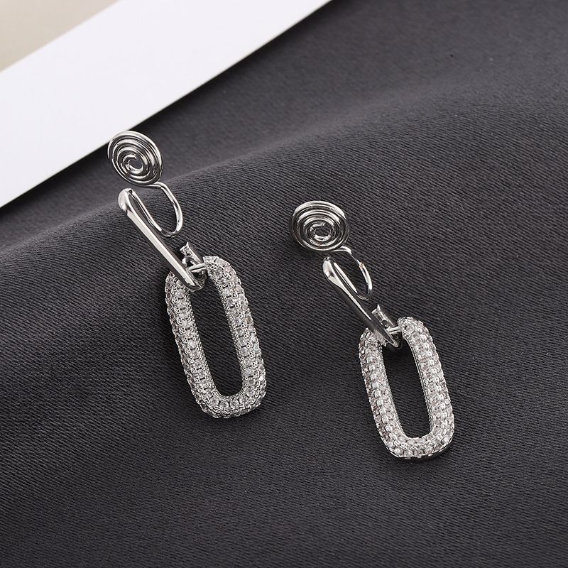 Oval-shaped mosquito-repellent incense coil ear clips for women, no ear holes, exaggerated and high-end personality, niche retro zircon earrings, metal