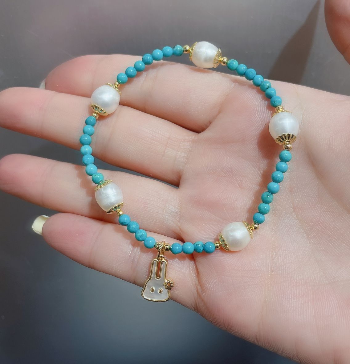 A new bracelet designed with original turquoise and natural pearls for the Year of the Rabbit, the zodiac year details Picture