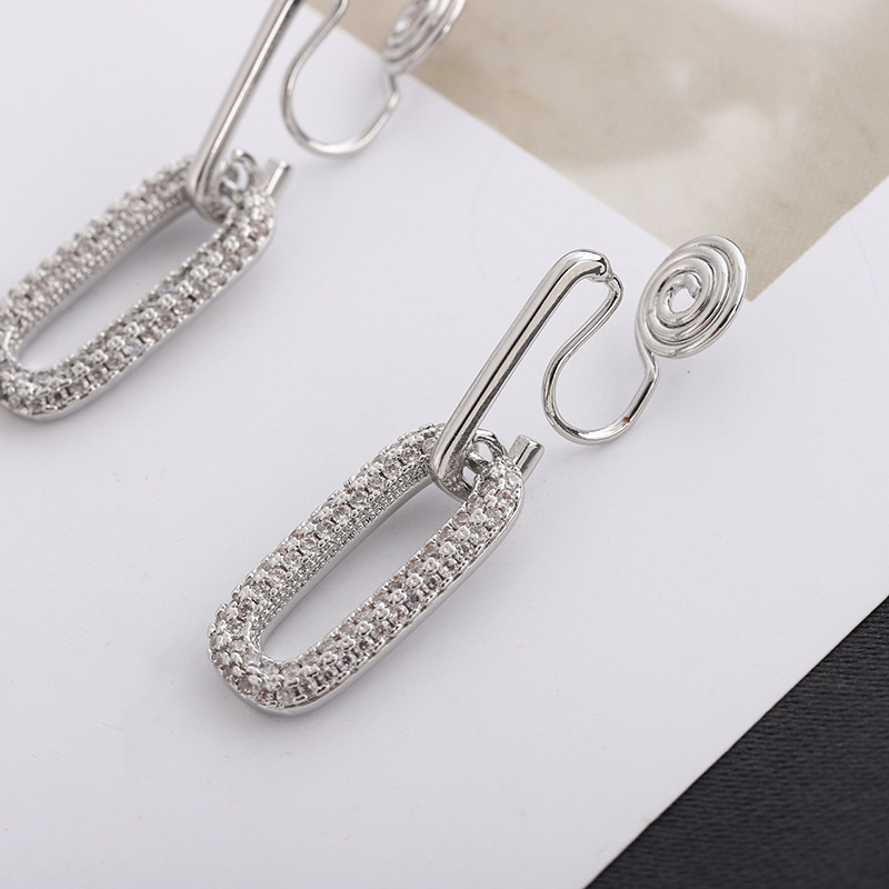 Oval-shaped mosquito-repellent incense coil ear clips for women, no ear holes, exaggerated and high-end personality, niche retro zircon earrings, metal detail image 4