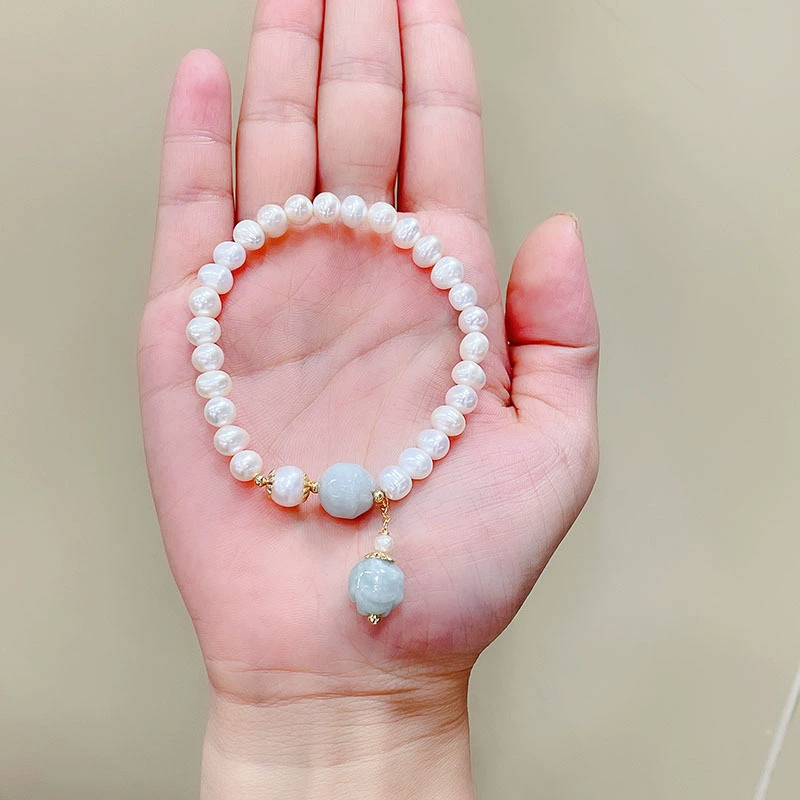 Live-streamed Korean version natural pearl bracelet, versatile women's handmade jade magnolia flower peace pendant pearl bracelet Application Scenario