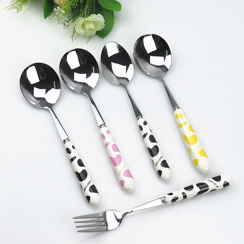 Stainless steel spoons and forks with ceramic handles and cow patterns