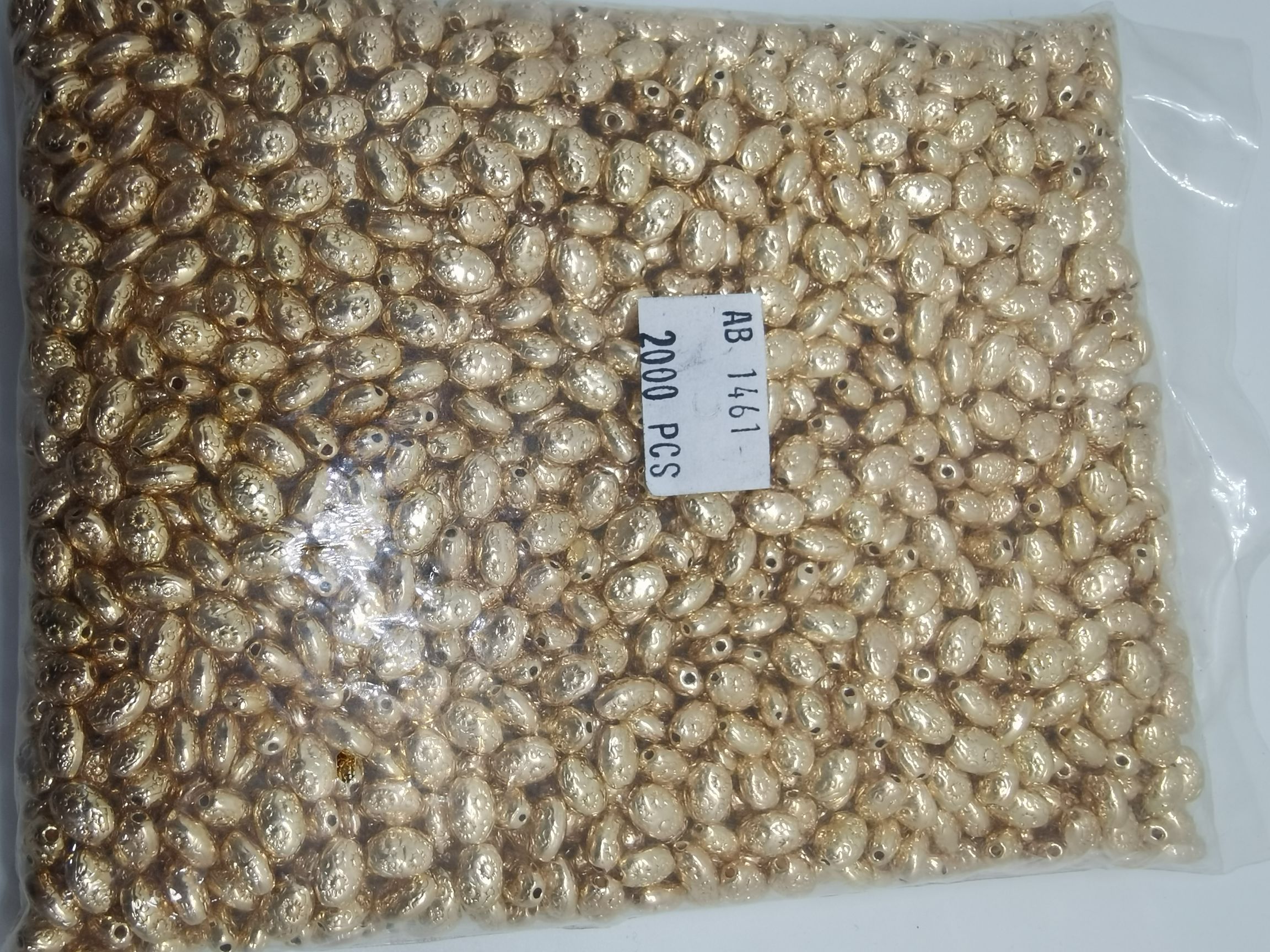 A pack of 2,000 KC gold flat beads
