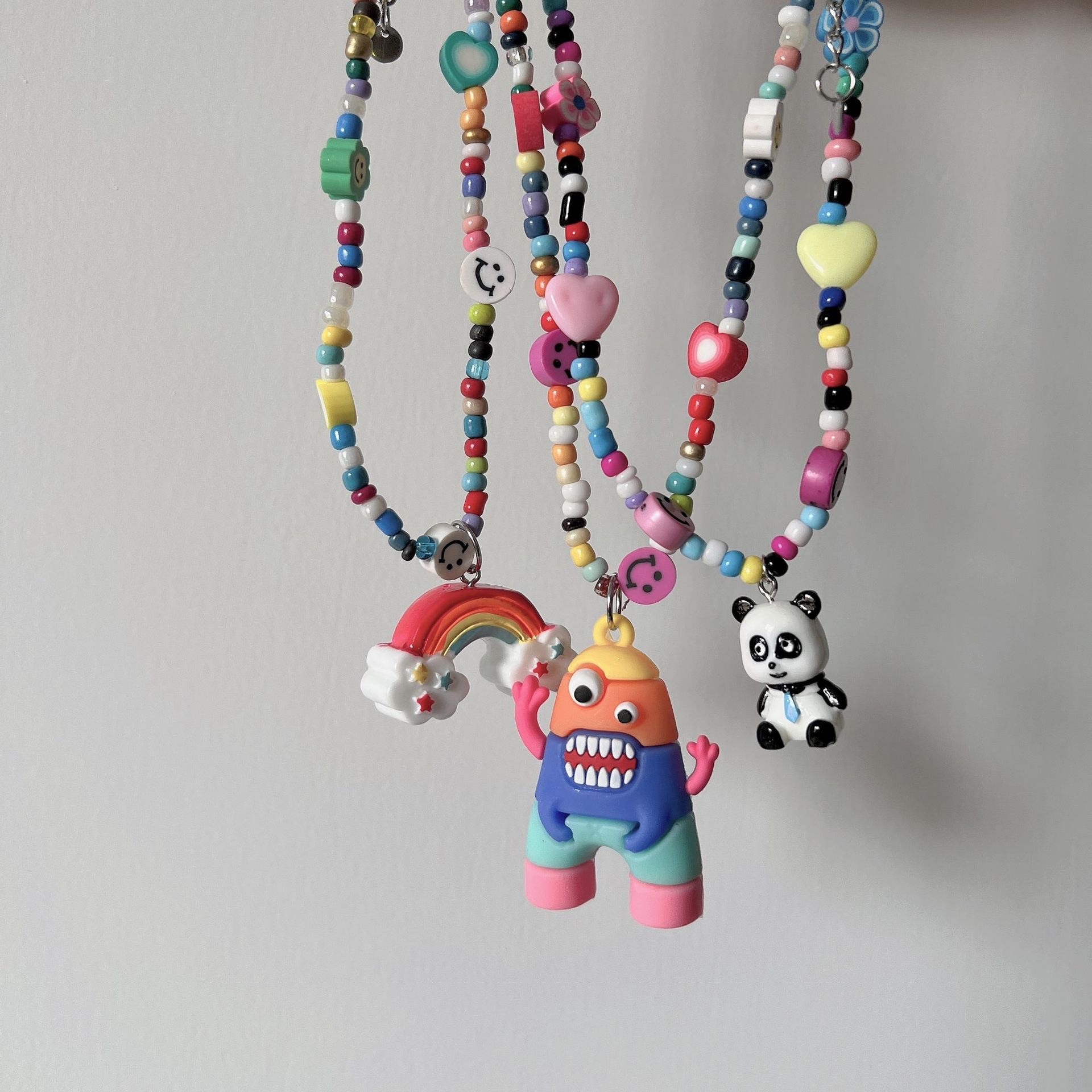 Internet-famous best-selling accessories: rice bead necklace, hip-hop dice smiley face, collarbone chain, female rainbow monster pendant, Korean version jewelry, Yuzu ear