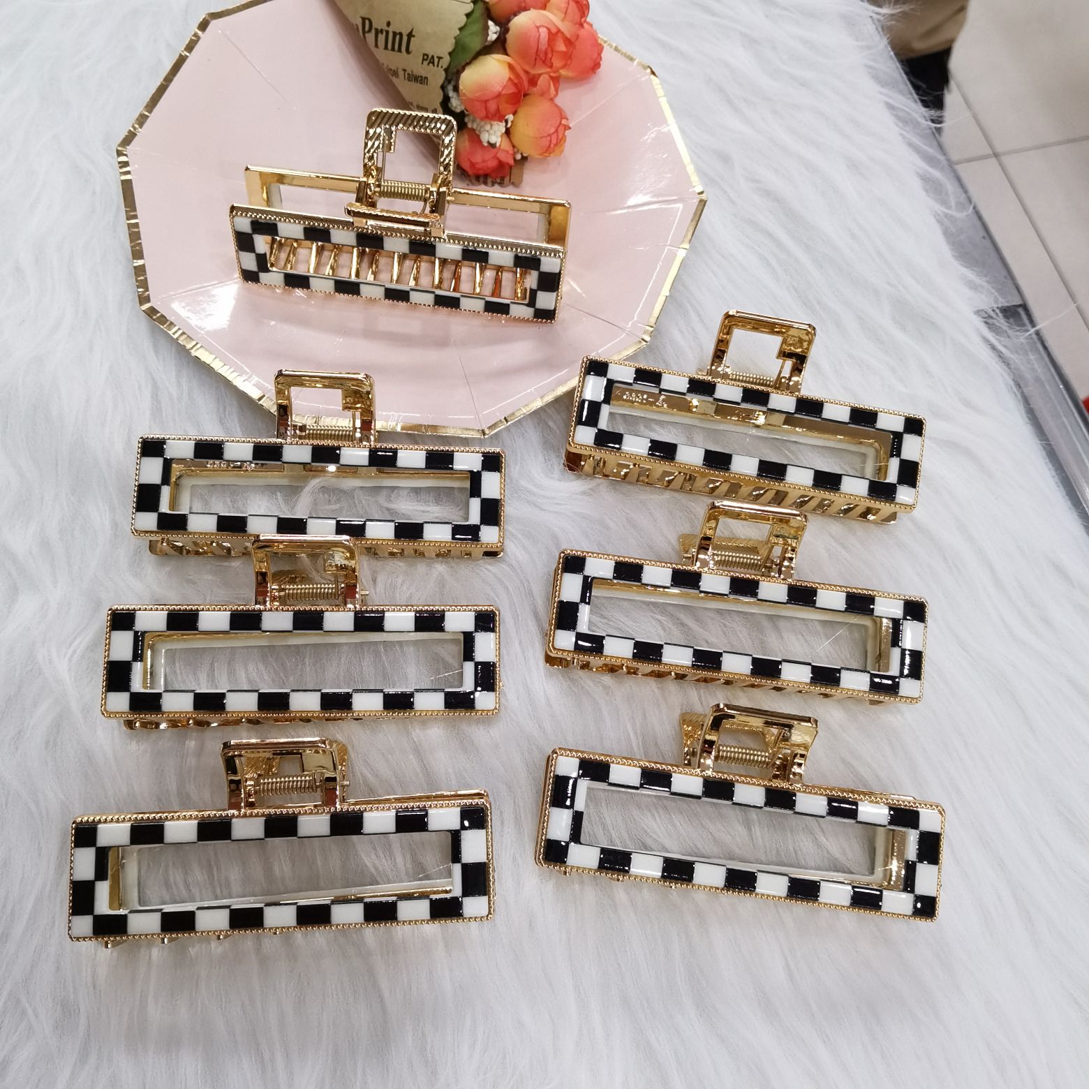 This is a popular and trendy item from Haishen jewelry. It features an alloy gold-plated base, a double-layer Korean style, and a classic and fashionable black and white checkered pattern details Picture