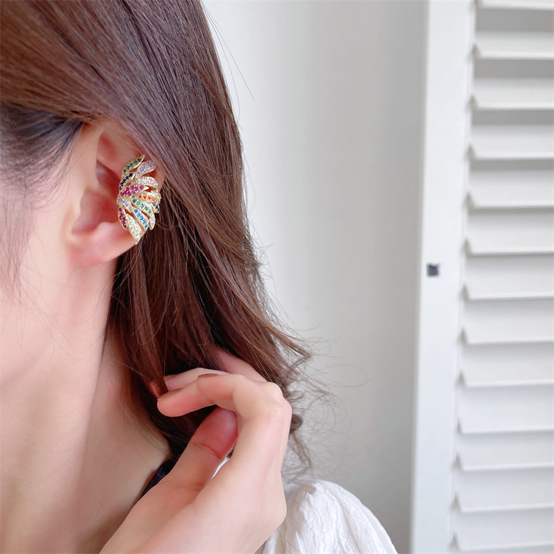 The 2022 new trendy earrings feature a light luxury and fashionable design with zircon inlays, creative feather wings, and no ear piercings or ear bone clips details Picture