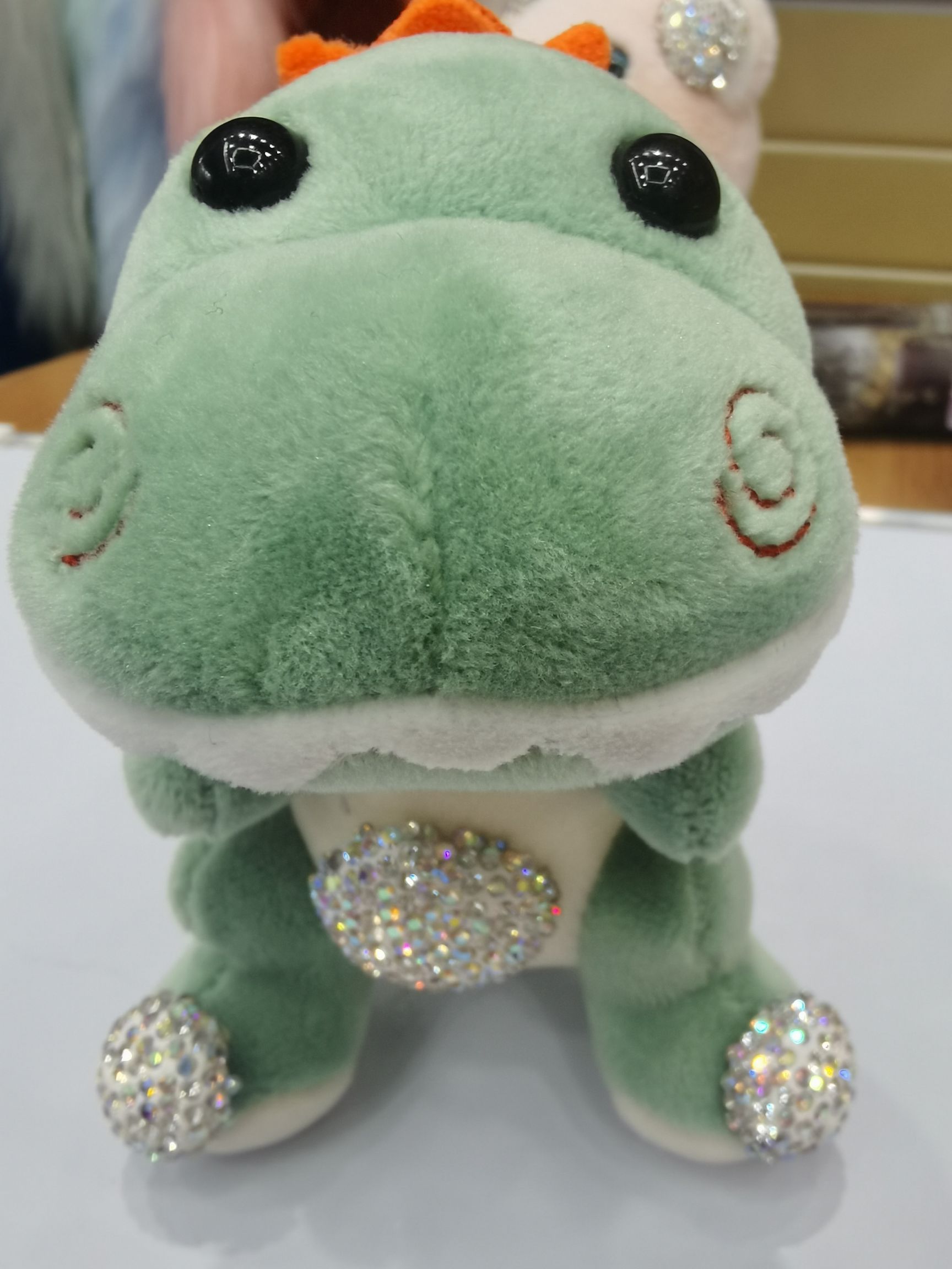 Factory direct sales: 3711 Qilisa accessories, including various plush balls, pendants, hairballs, and hair hoop headbands. New trendy and cute pet 14cm dinosaur keychains with diamonds in two colors