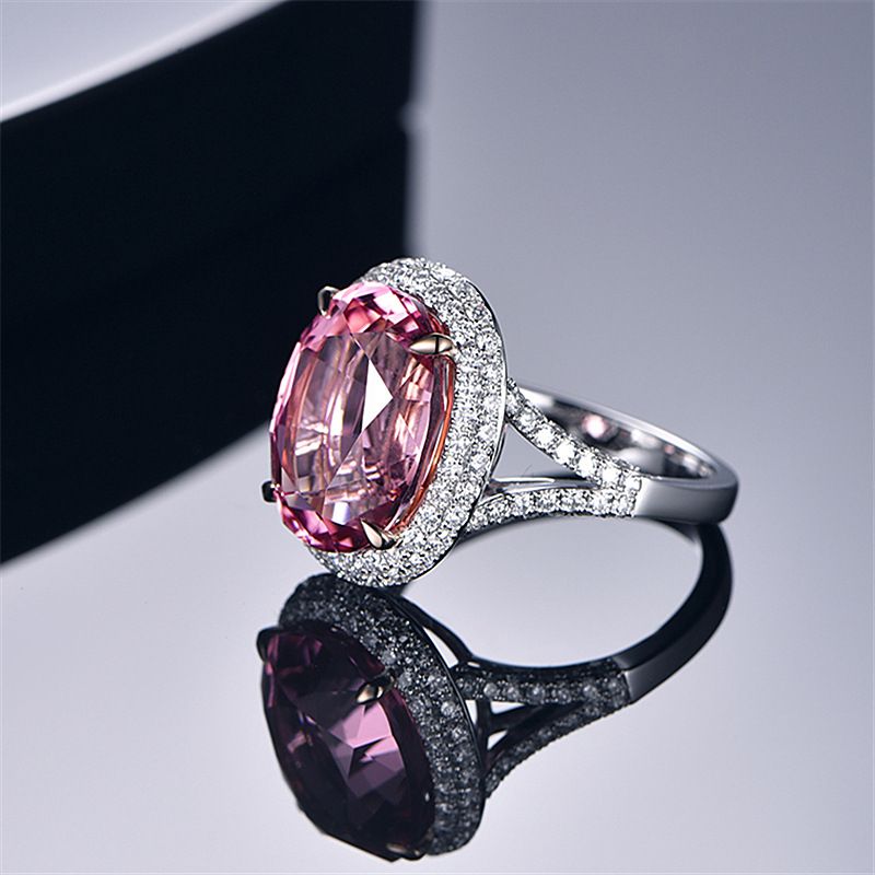 A pink zirconium ring set with a large loose diamond and pink diamonds Item Picture