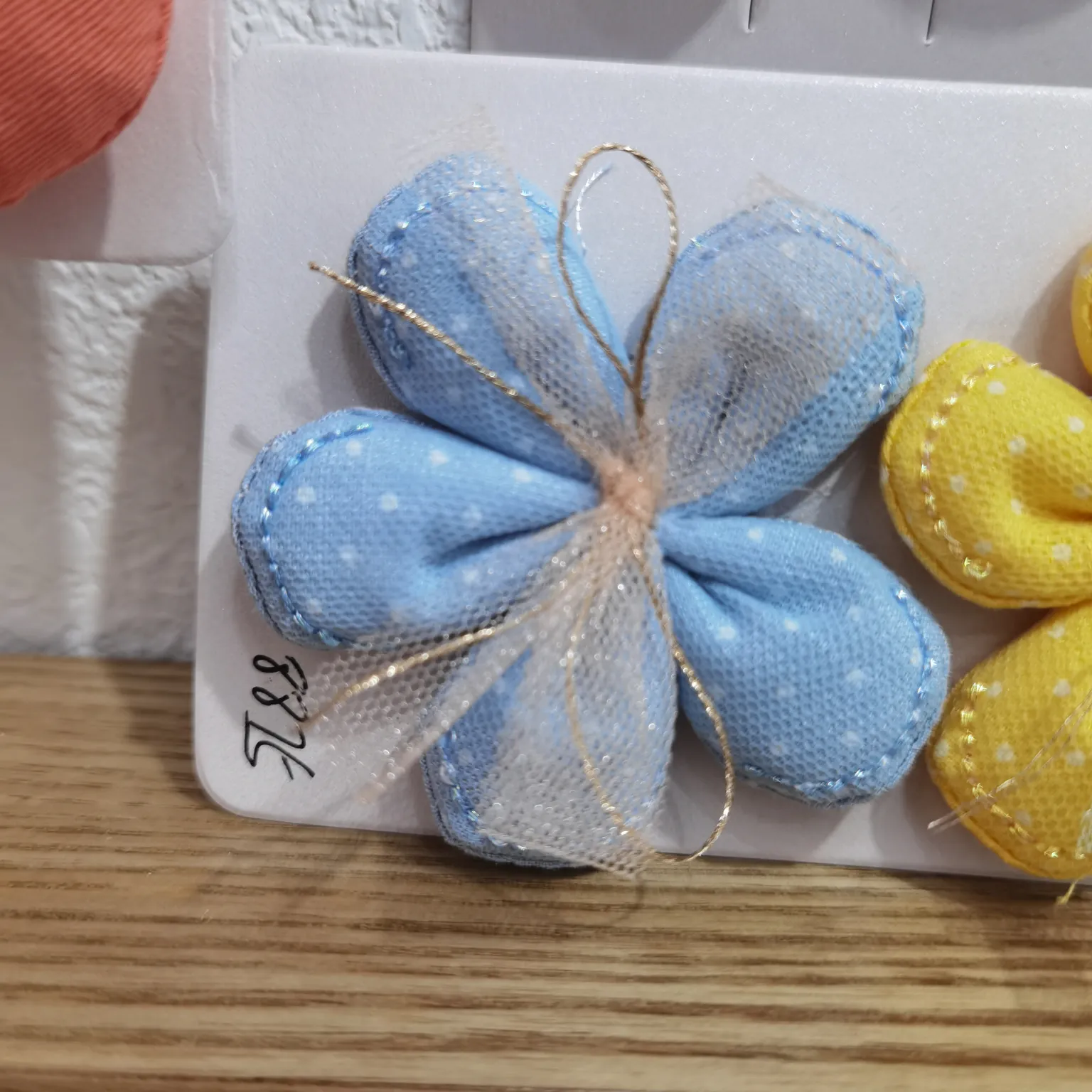 Dotted cotton five-petal flowers with gauze leads in blue details Picture