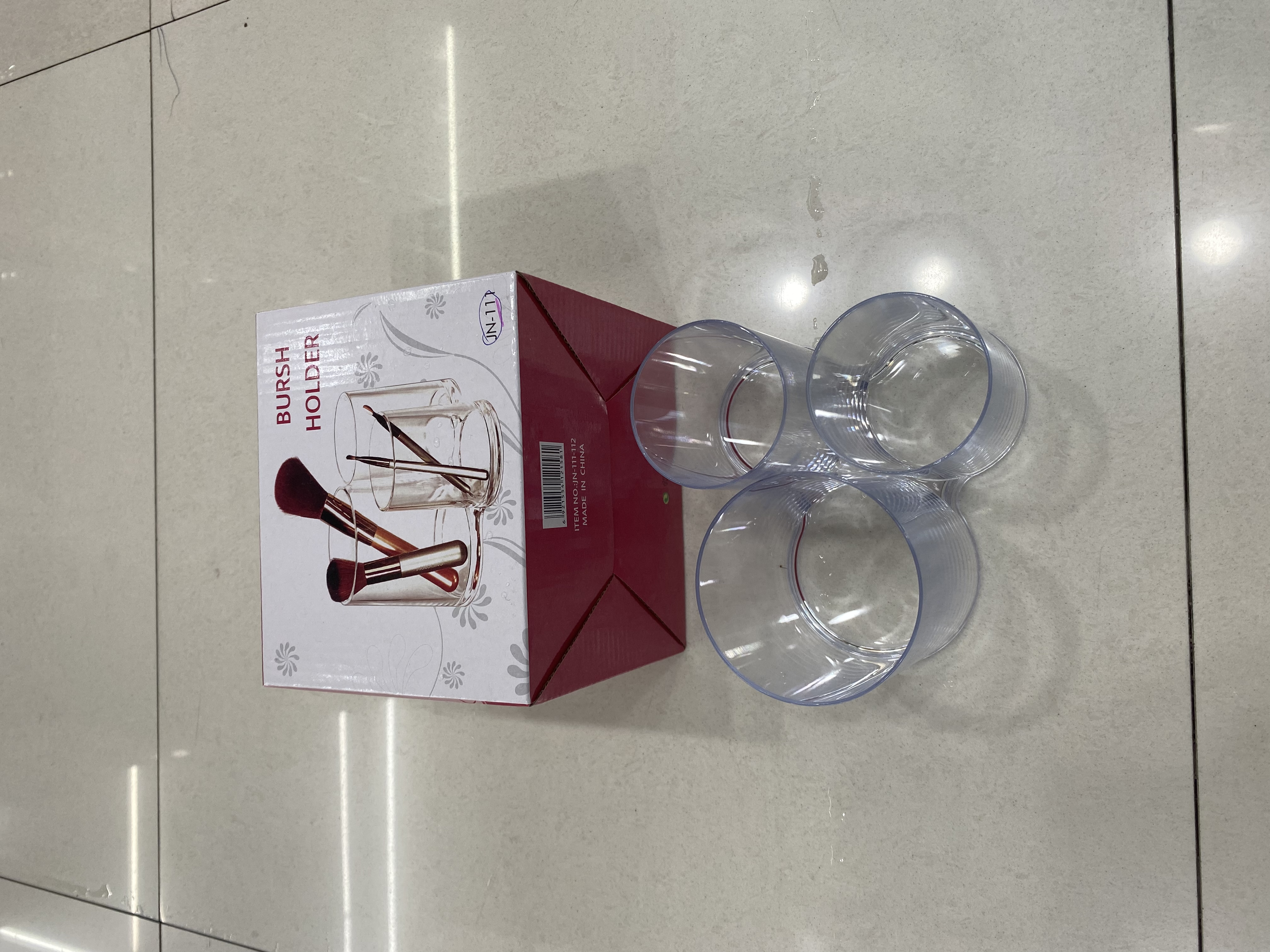Three-cup makeup stand