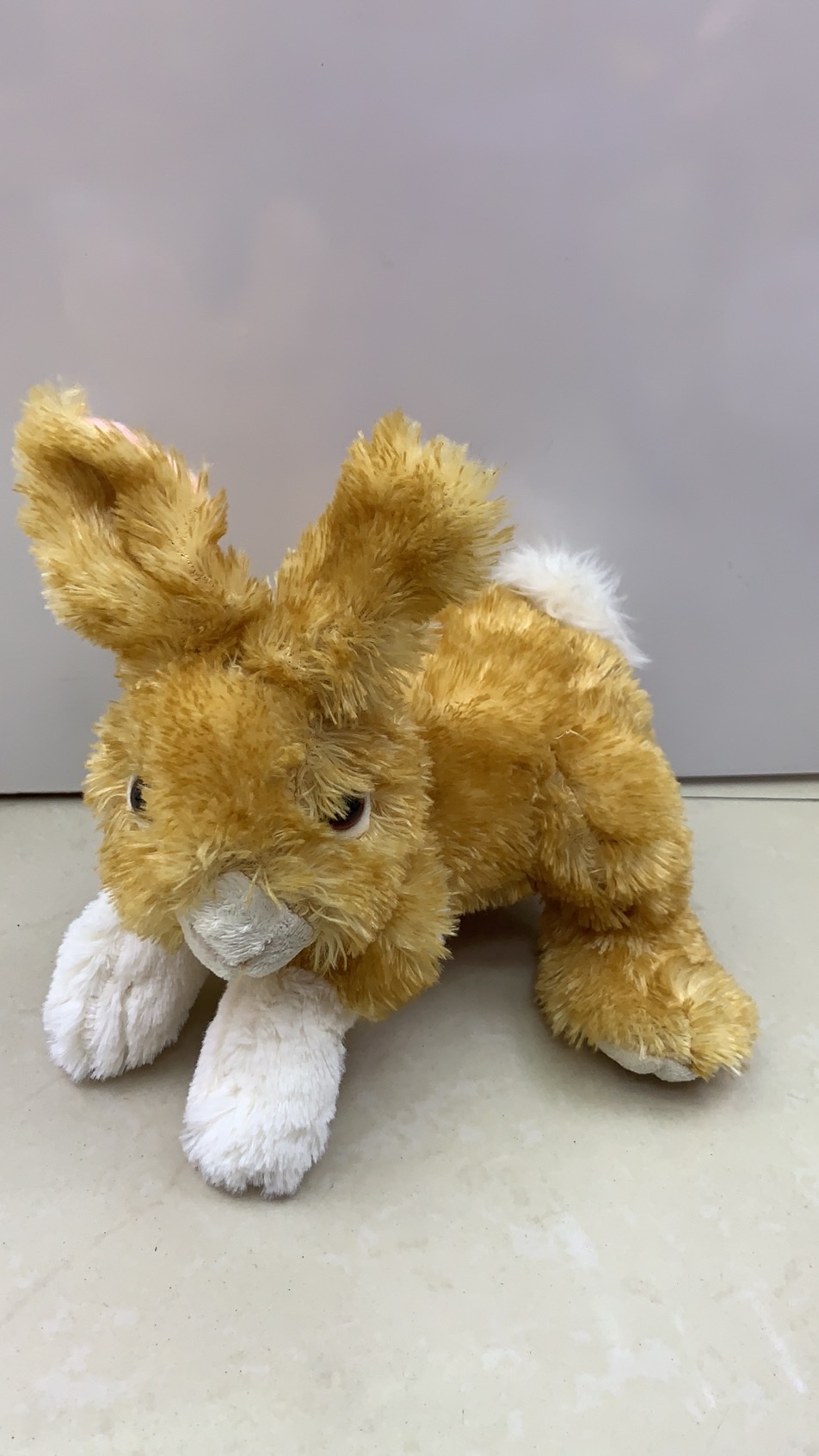 A wonderful plush toy of a crawling rabbit