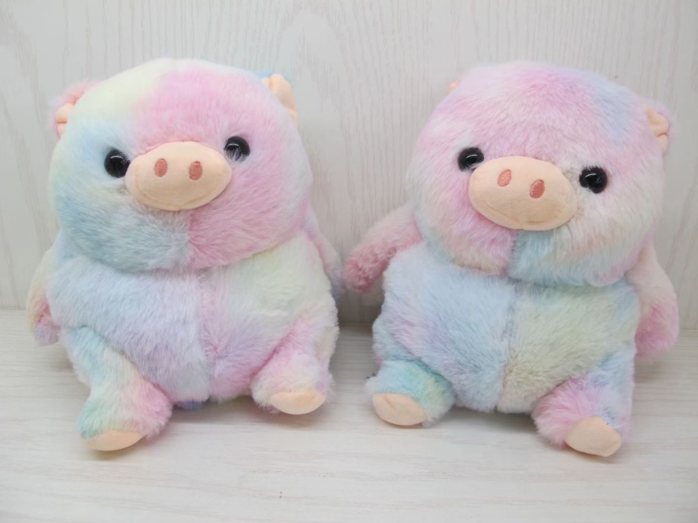 A wonderful plush toy of colorful pigs