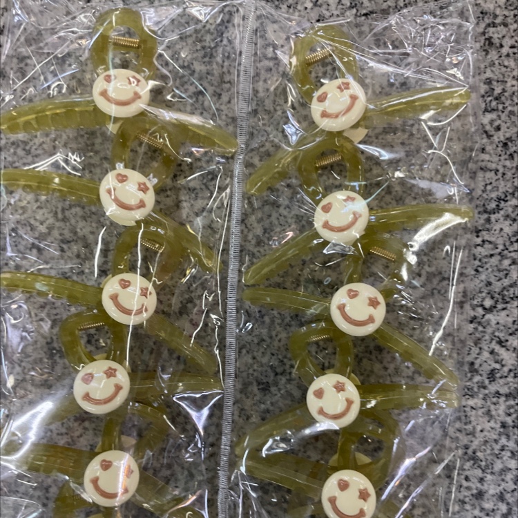 Green smiling face with big claws