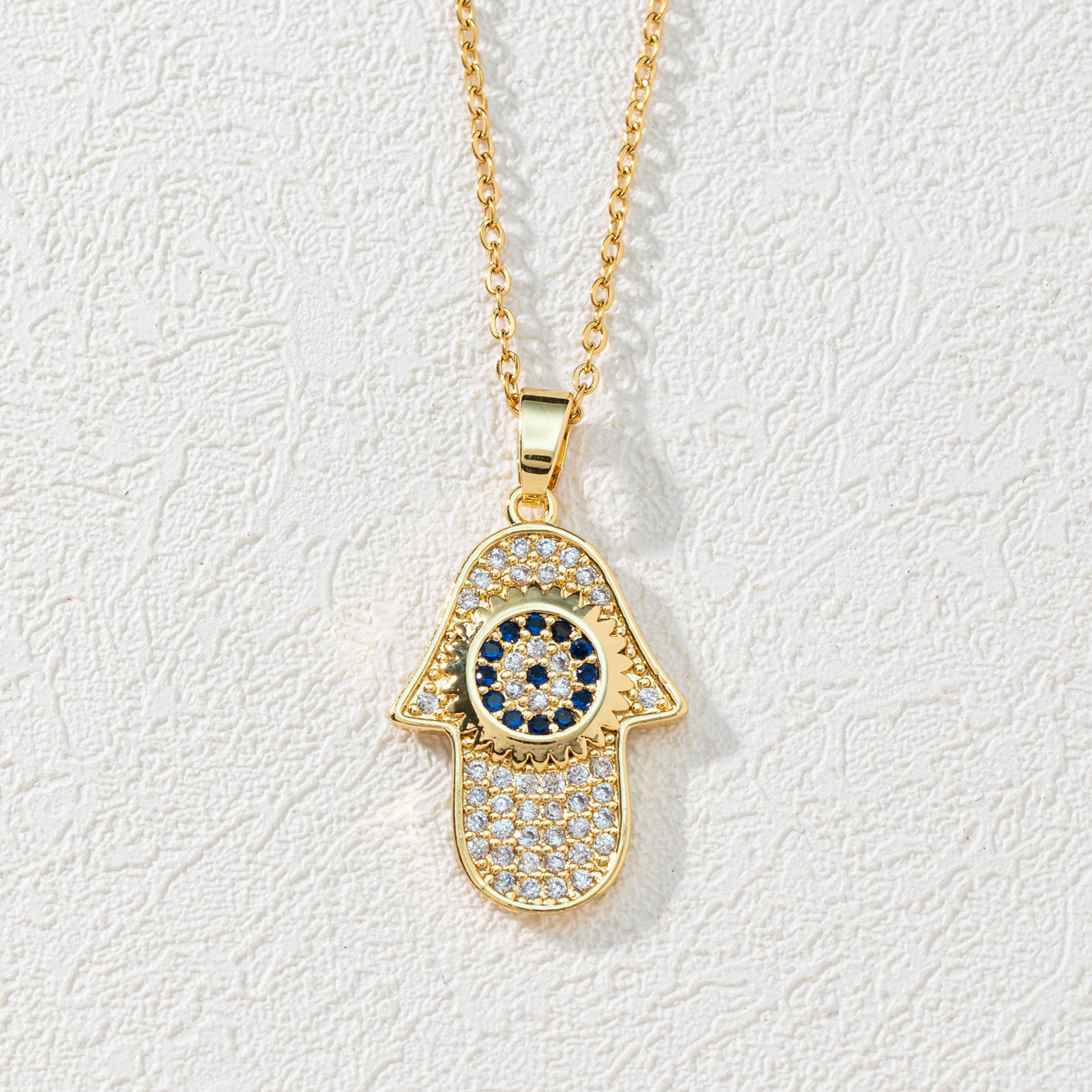 A new European and American fashion trend copper zircon Devil's eye palm necklace pendant with micro-inlaid electroplated real gold sweater chain Item Picture