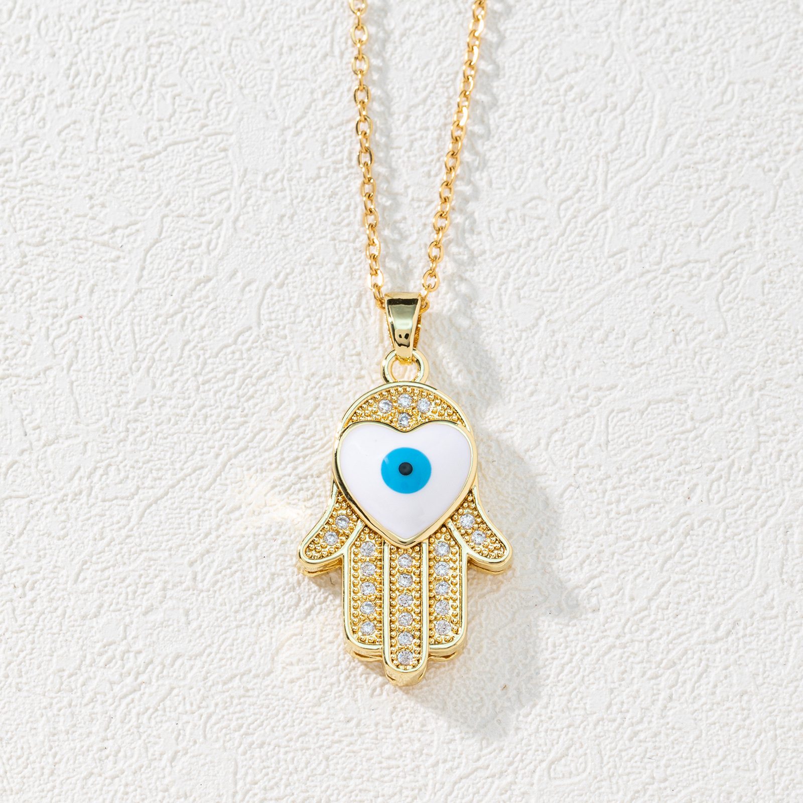 A new European and American fashion trend copper zircon Devil's eye palm necklace pendant with micro-inlaid electroplated real gold sweater chain Specification image