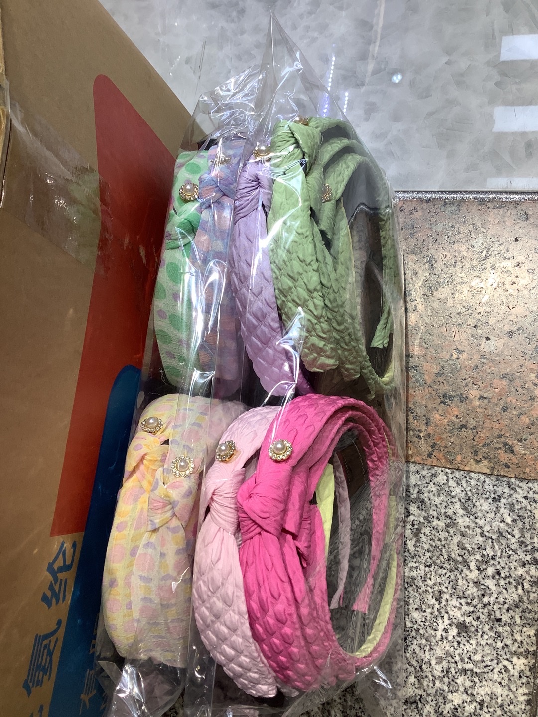 The wide net is knotted and stuck with a drill